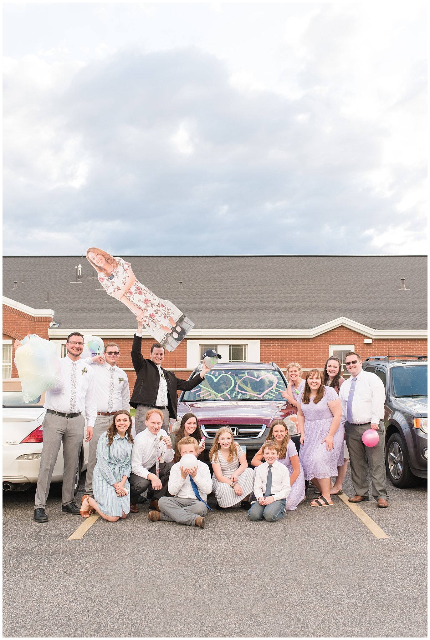 Friends decorating bride and groom's car | Utah Wedding | Jessie and Dallin Photography