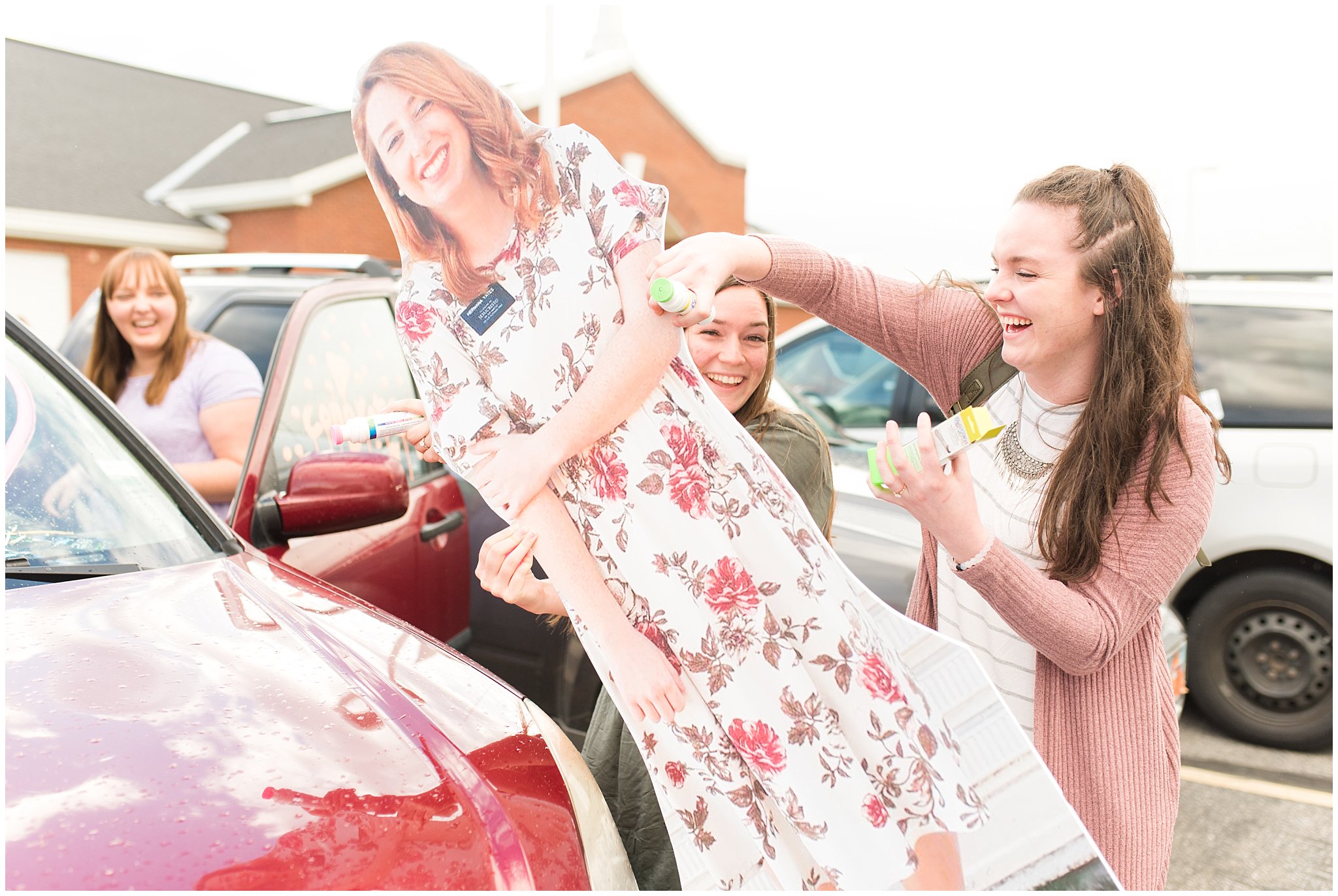 Friends decorating bride and groom's car | Utah Wedding | Jessie and Dallin Photography