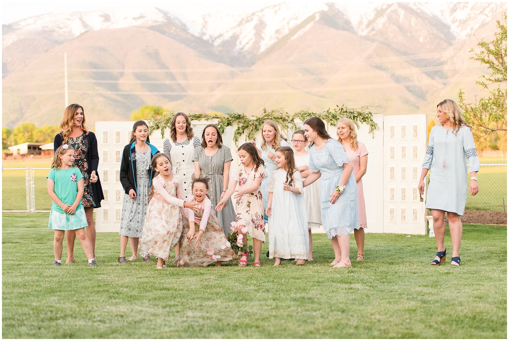 Bouquet toss outdoors | Backyard outdoor spring wedding with grey, blush, and light blue wedding colors | Spring Provo City Center Temple Wedding | Utah Wedding Photographers | Jessie and Dallin Photography