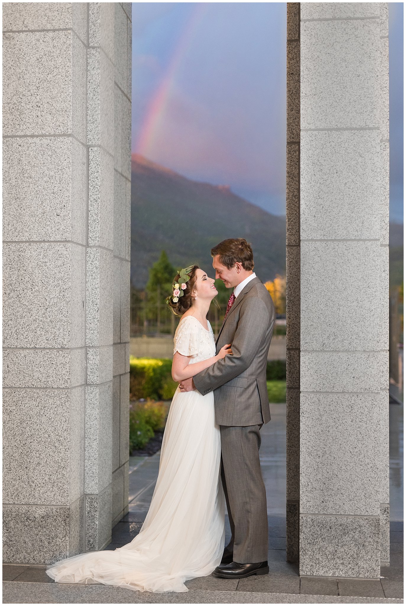 Rainbow during session with bride in flower crown and groom in grey suit with maroon tie | Grey, gold, and maroon wedding colors | Draper Temple Spring Formal Session | Jessie and Dallin Photography