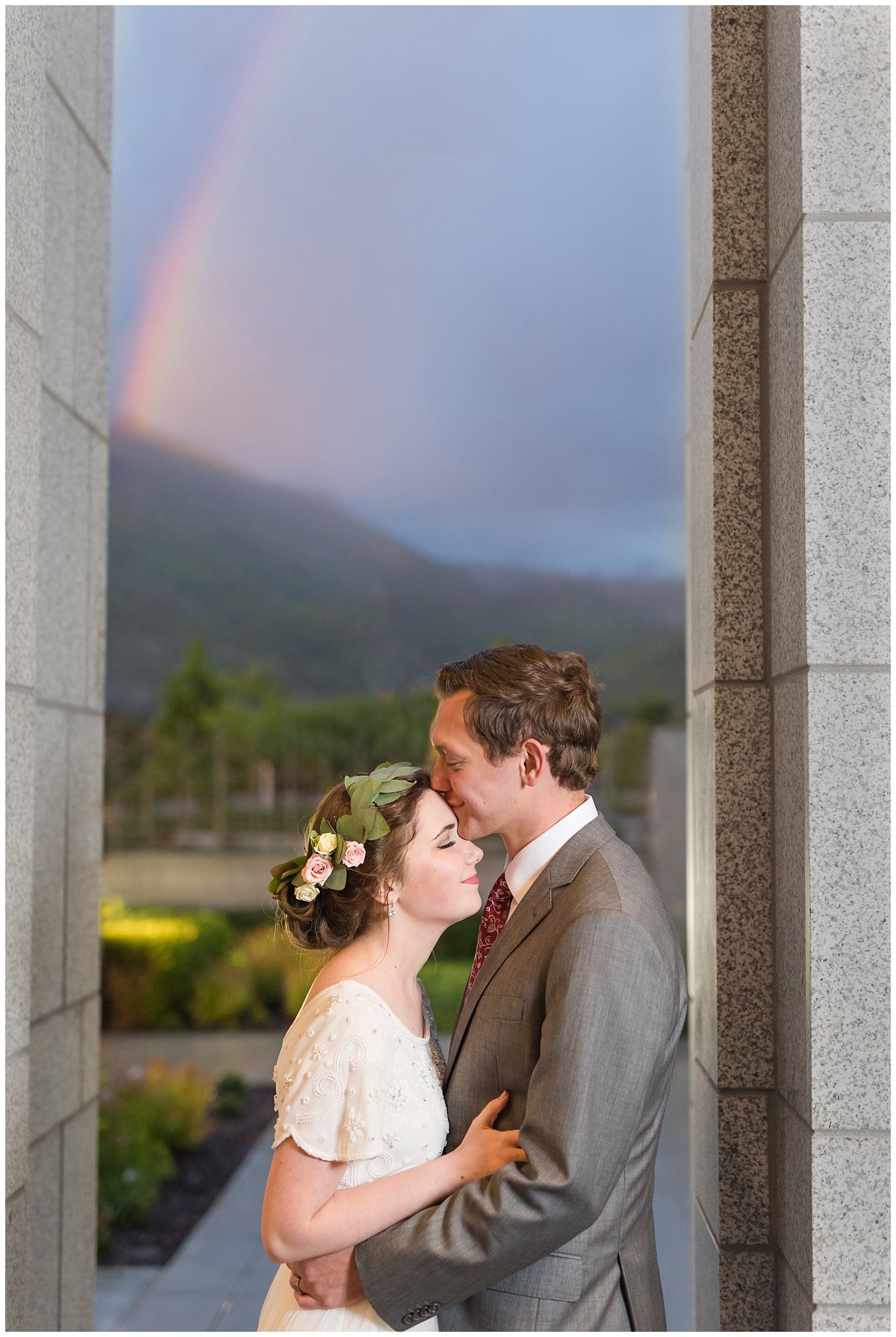 Rainbow during session with bride in flower crown and groom in grey suit with maroon tie | Grey, gold, and maroon wedding colors | Draper Temple Spring Formal Session | Jessie and Dallin Photography