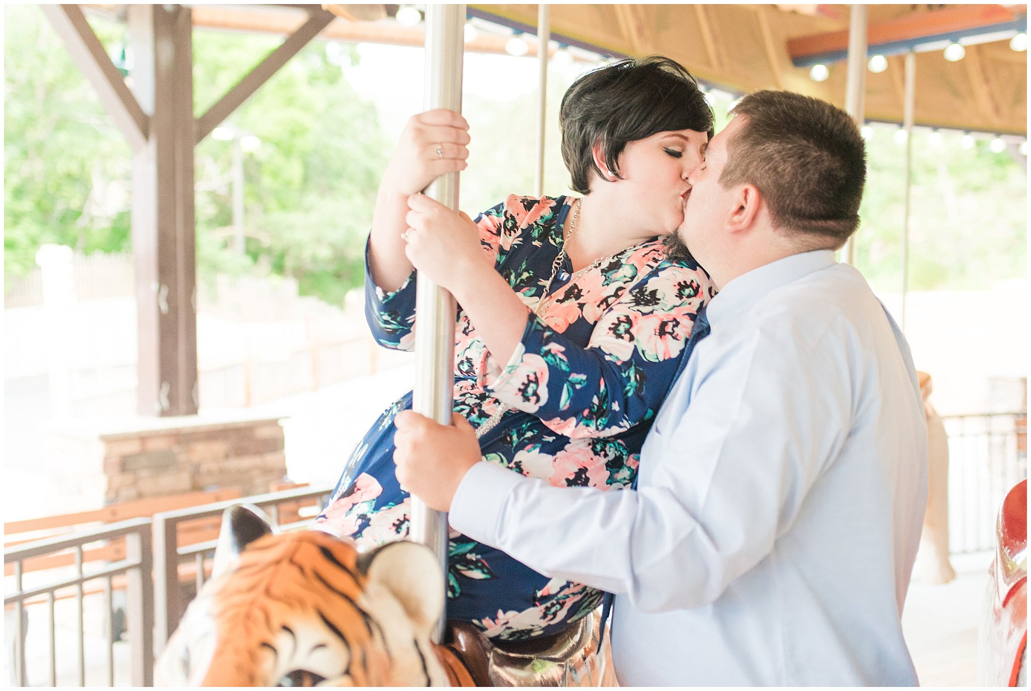 Couple visiting the zoo and riding the carousel for their engagement session | Hogle Zoo Engagement Session | Fun and unique engagement | Utah Engagement Photography | Jessie and Dallin Photography