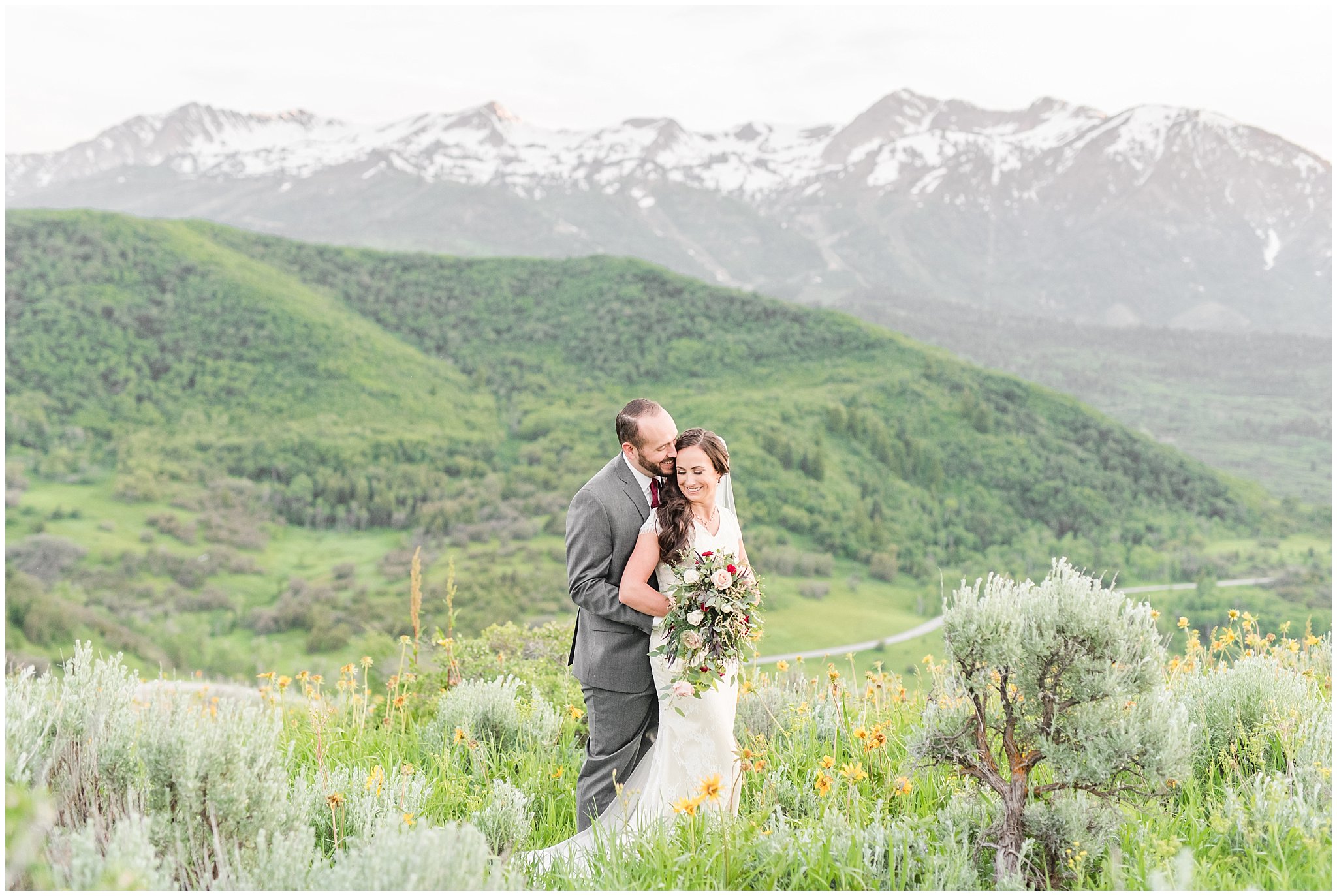 Bride and groom portraits in the mountains | Groom in grey suit and bride in beige and white dress with waterfall bouquet | Snowbasin Summer Formal Session | Utah Wedding Photographers | Jessie and Dallin