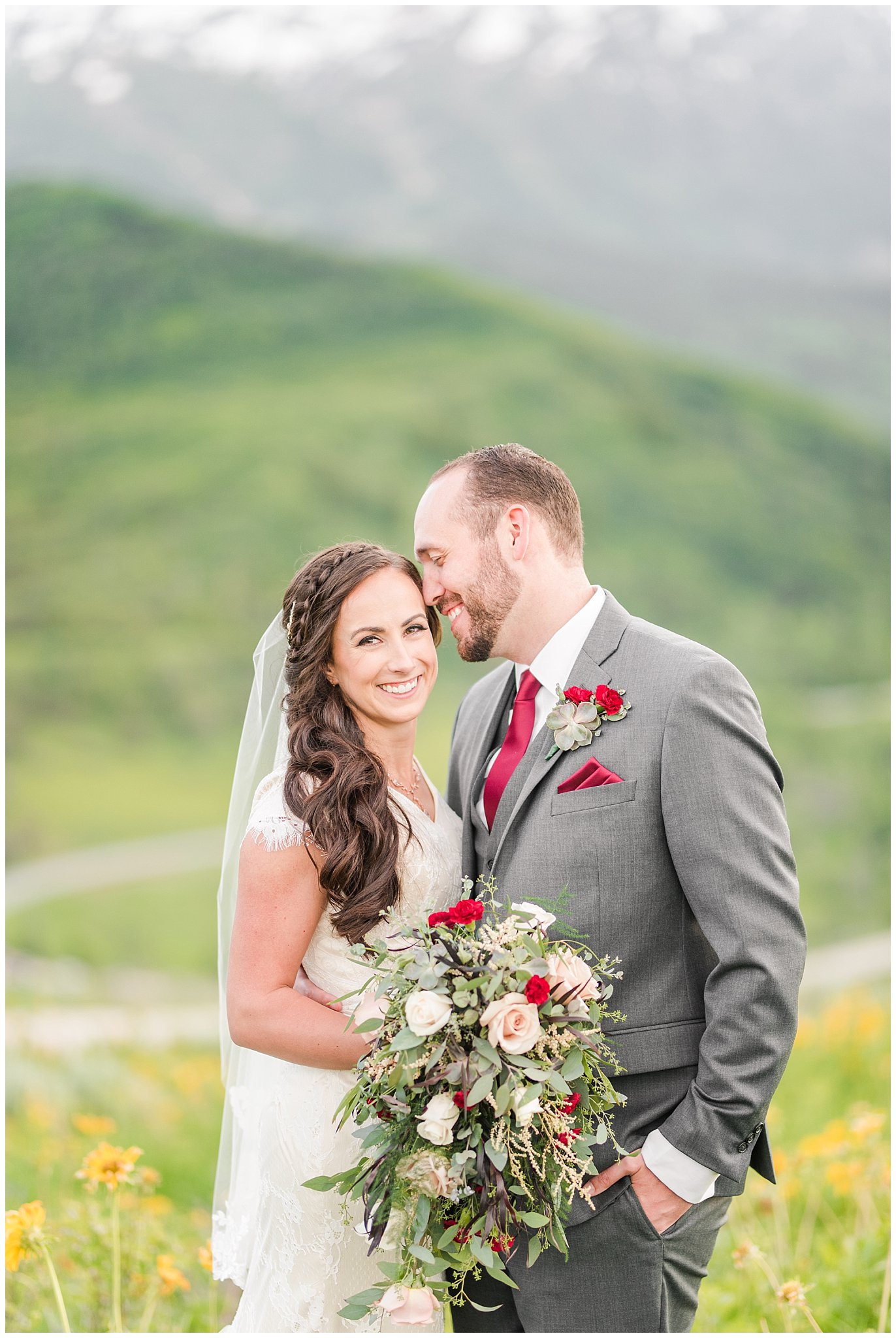 Bride and groom portraits in the mountains | Groom in grey suit and bride in beige and white dress with waterfall bouquet | Snowbasin Summer Formal Session | Utah Wedding Photographers | Jessie and Dallin