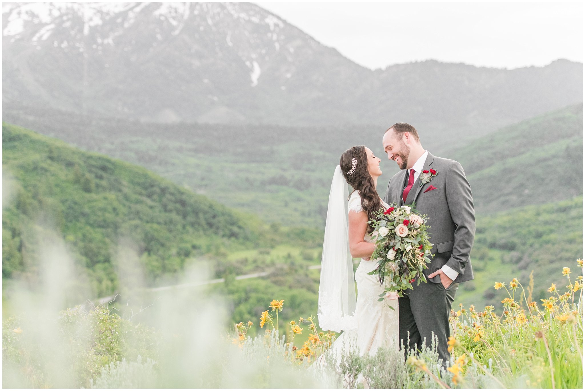 Bride and groom portraits in the mountains | Groom in grey suit and bride in beige and white dress with waterfall bouquet | Snowbasin Summer Formal Session | Utah Wedding Photographers | Jessie and Dallin