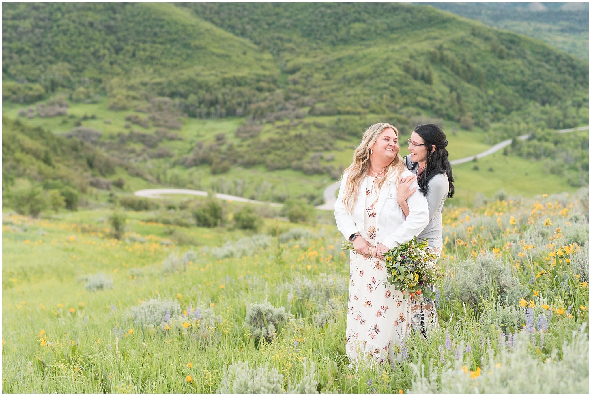 Couple in the mountains with bouquet and sunflowers | Summer Mountain Engagement | Jessie and Dallin Photography