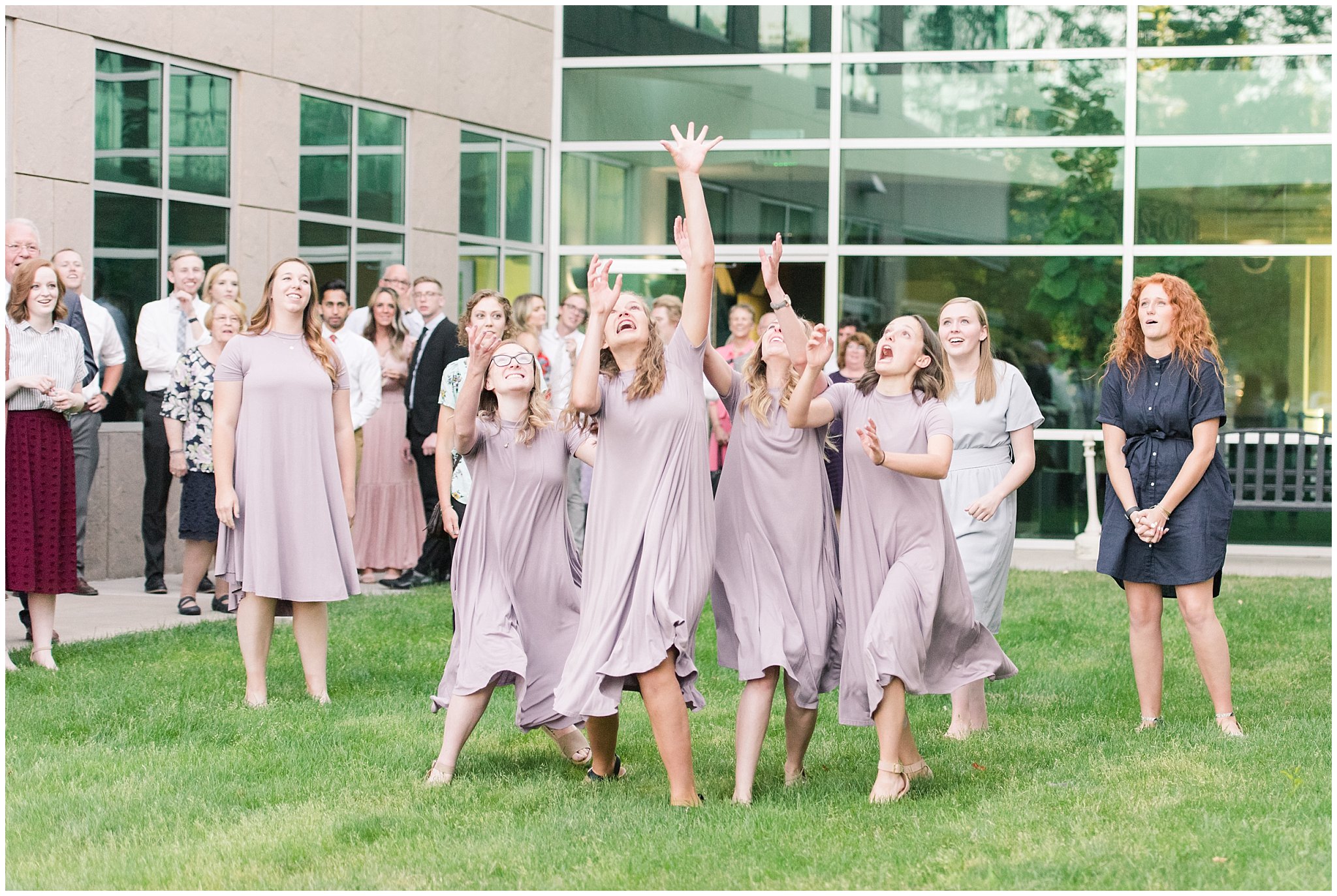 Fun Bouquet toss with a lot of bridesmaids outdoors | Salt Lake Temple Wedding and Clearfield City Hall Reception | Utah Wedding Photographers | Jessie and Dallin Photography