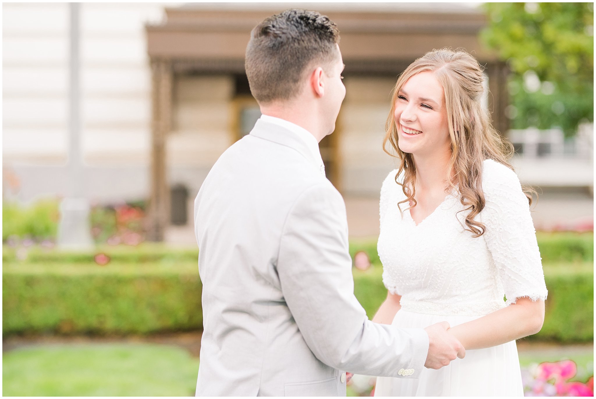 Bride and groom have first look while wearing veil and grey suit with lavender florals | Elegant formal session at the Salt Lake Temple and Ensign Peak Formal Session | Jessie and Dallin Photography