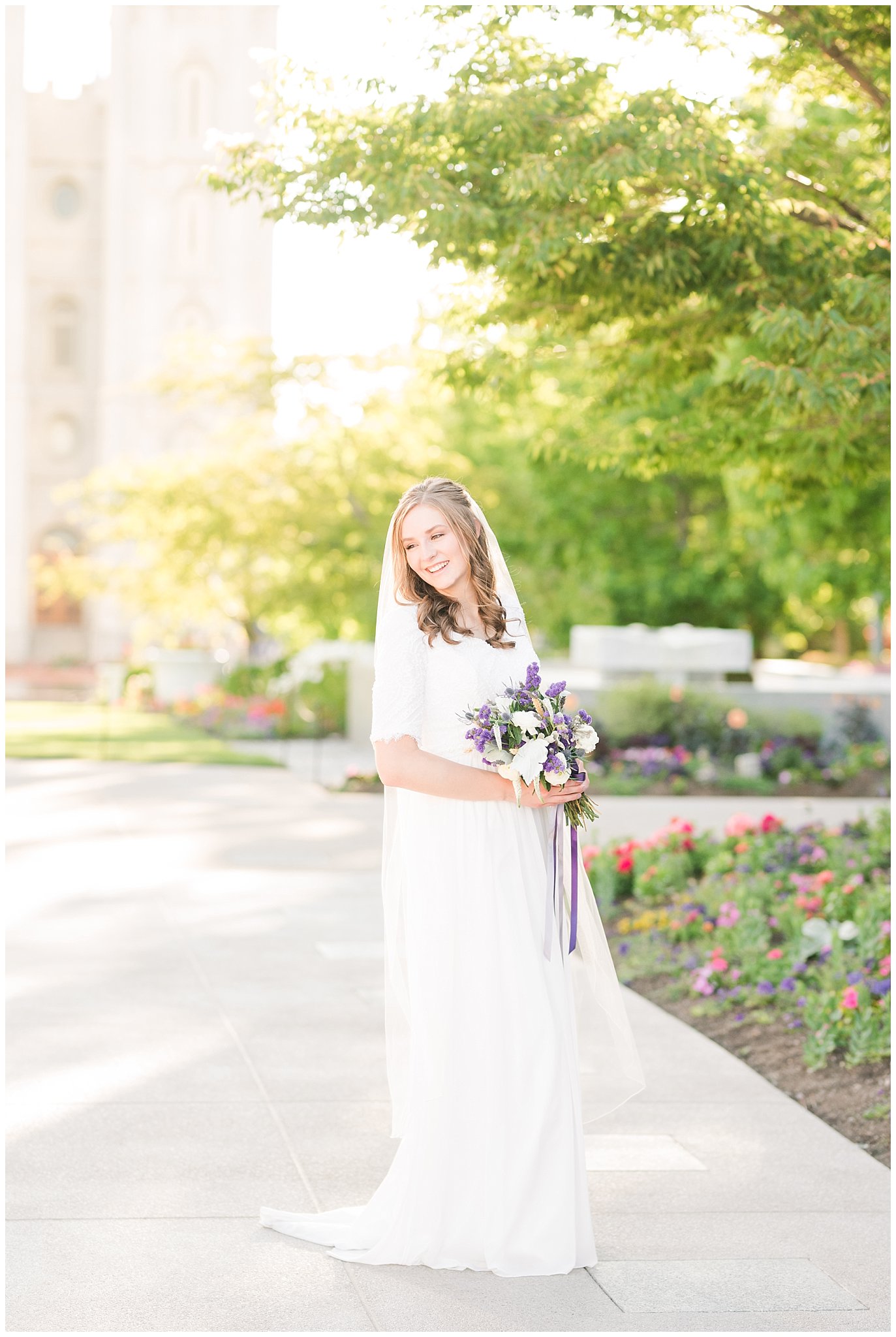 Bride wearing elegant, simple dress with veil with lavender florals | Elegant formal session at the Salt Lake Temple and Ensign Peak Formal Session | Jessie and Dallin Photography