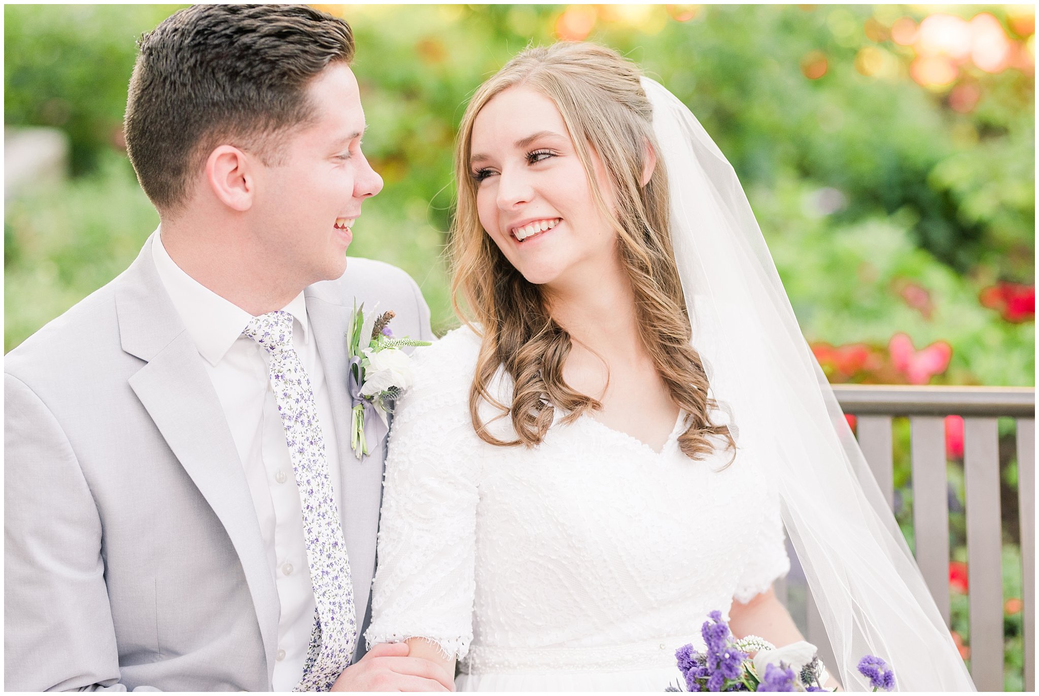 Bride and groom wearing elegant, simple dress with veil and grey suit with lavendar florals | Elegant formal session at the Salt Lake Temple and Ensign Peak Formal Session | Jessie and Dallin Photography