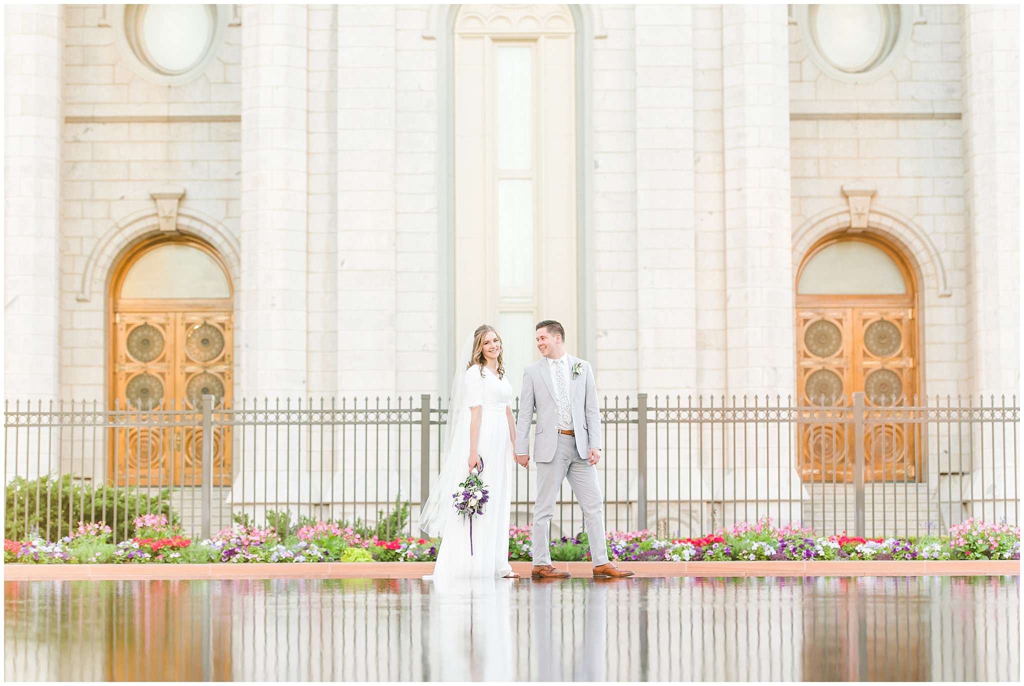 Bride and groom wearing elegant, simple dress with veil and grey suit with lavender florals | Elegant formal session at the Salt Lake Temple and Ensign Peak Formal Session | Jessie and Dallin Photography