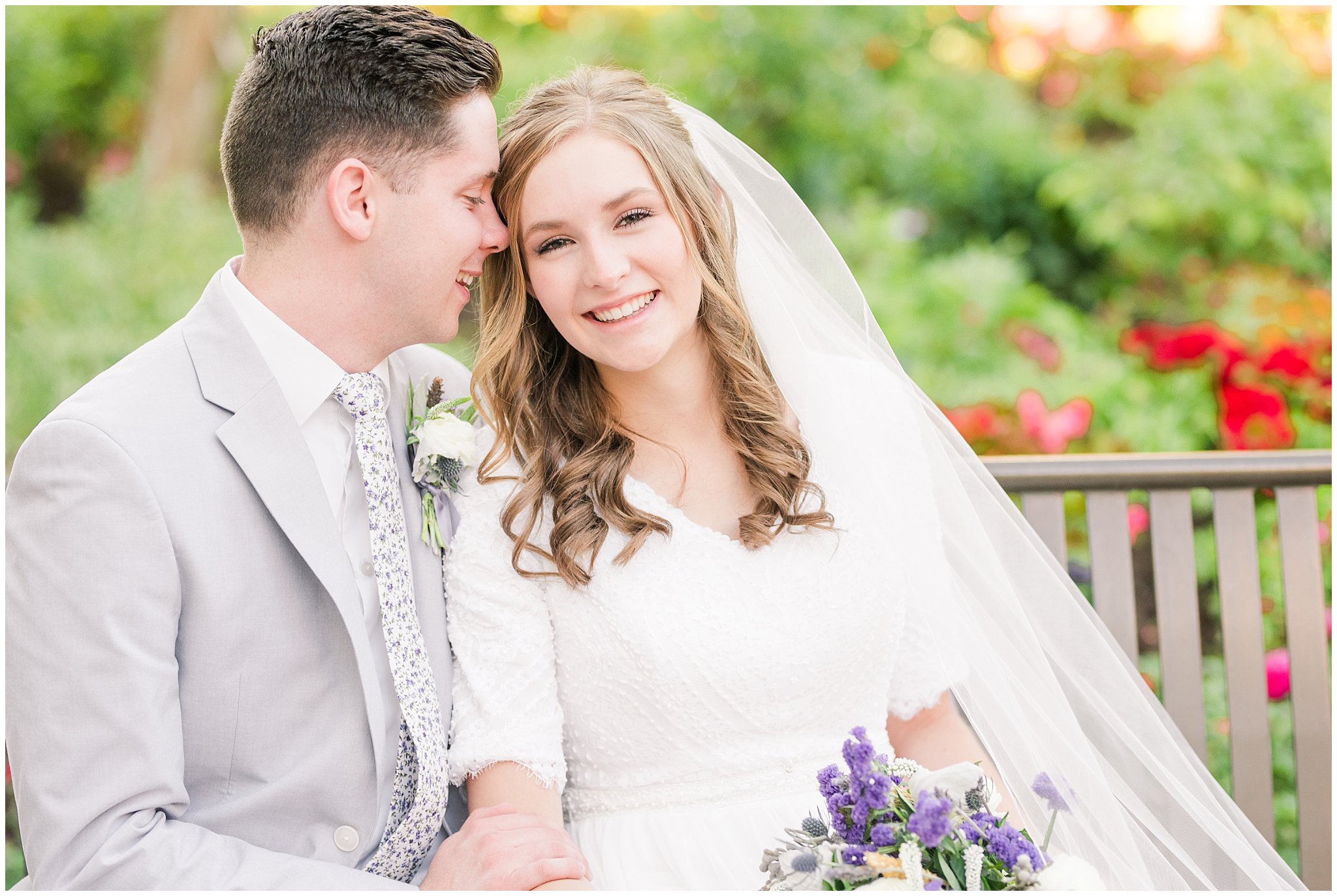 Bride and groom wearing elegant, simple dress with veil and grey suit with lavender florals | Elegant formal session at the Salt Lake Temple and Ensign Peak Formal Session | Jessie and Dallin Photography