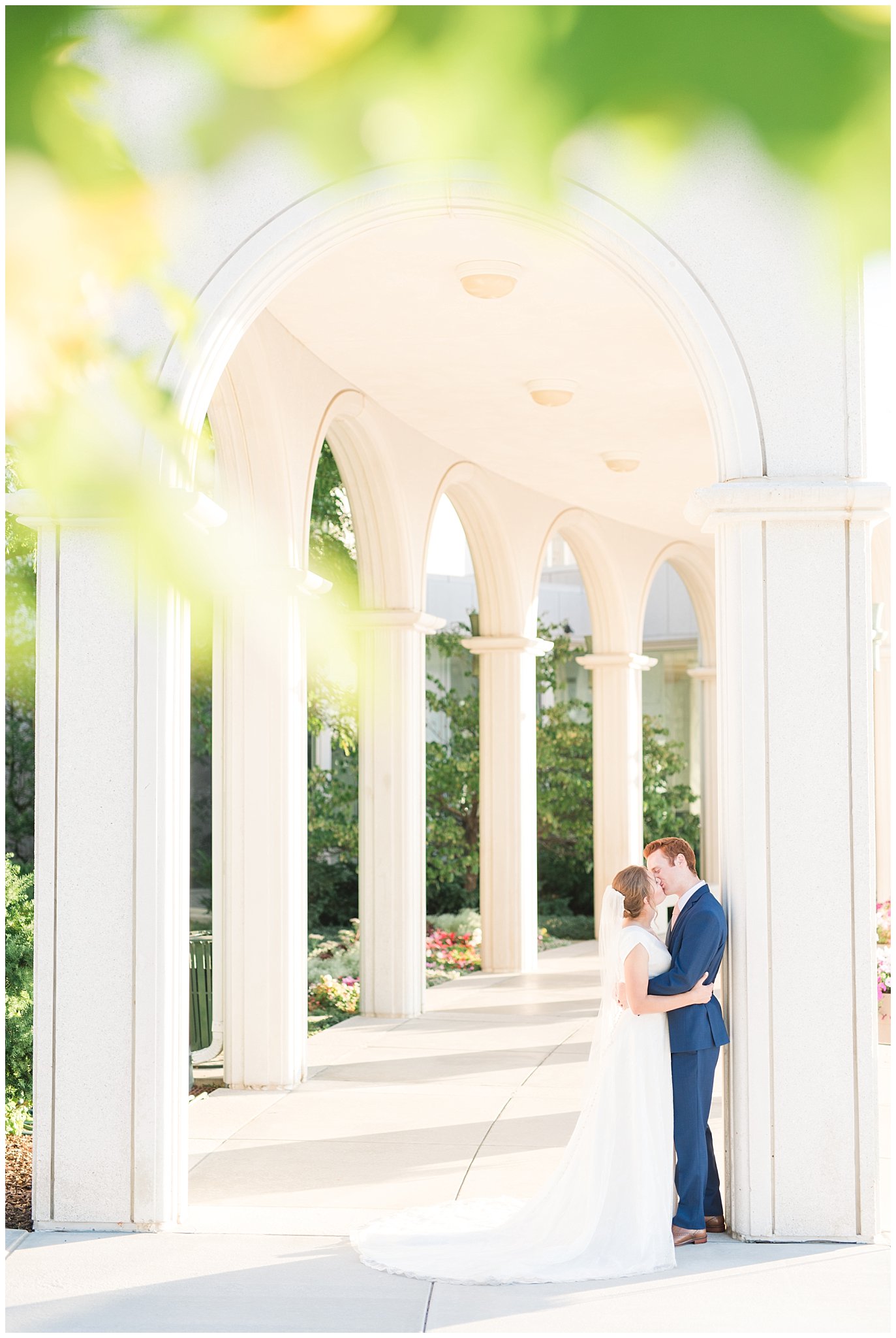 Bride and groom portraits with bride in simple elegant dress and groom in blue suit with blush tie at the Bountiful Temple | Bountiful Temple Summer Formal Session | Utah Weddings | Jessie and Dallin Photography