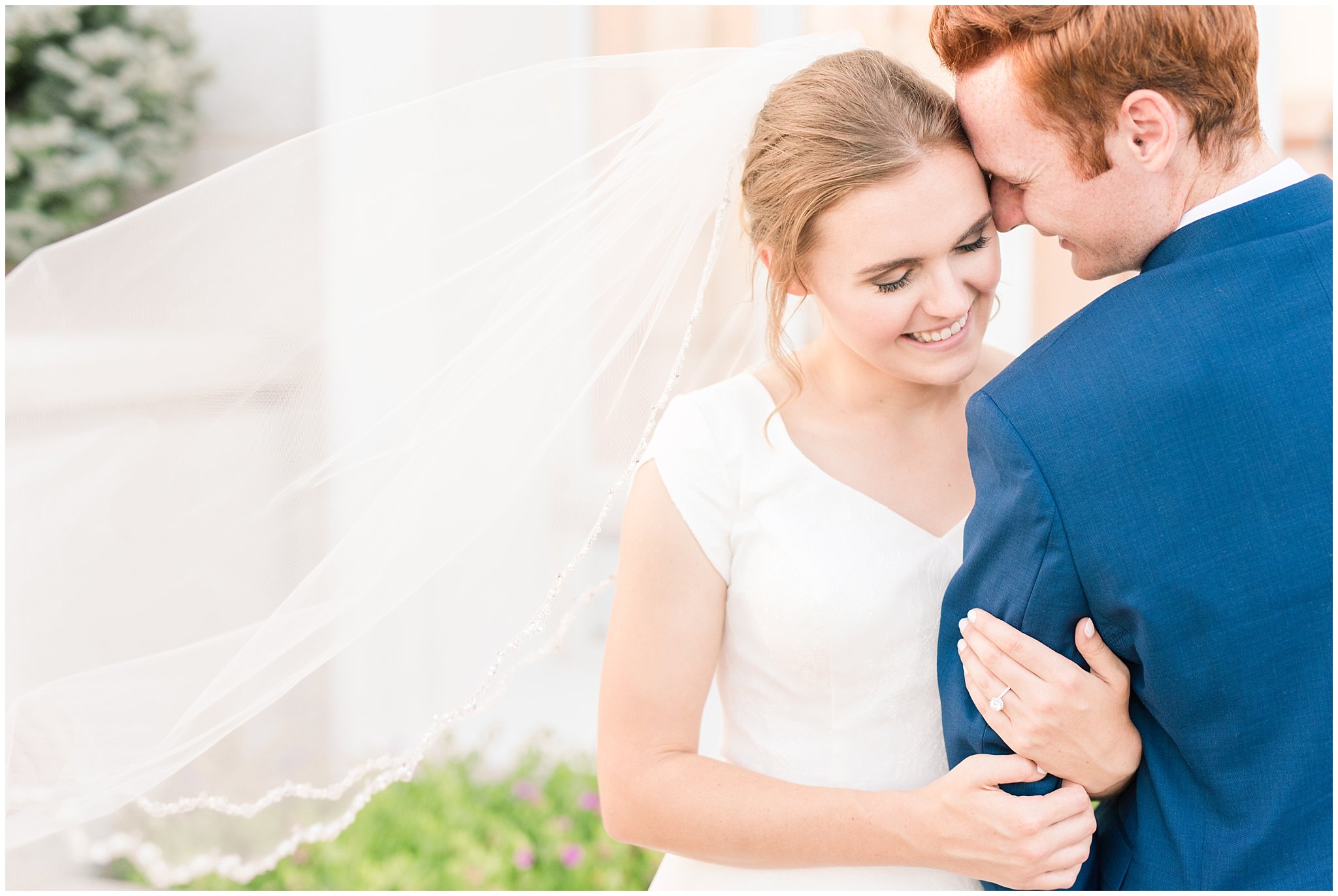 Bride and groom portraits with bride in simple elegant dress and veil, and groom in blue suit with blush tie at the Bountiful Temple | Bountiful Temple Summer Formal Session | Utah Weddings | Jessie and Dallin Photography