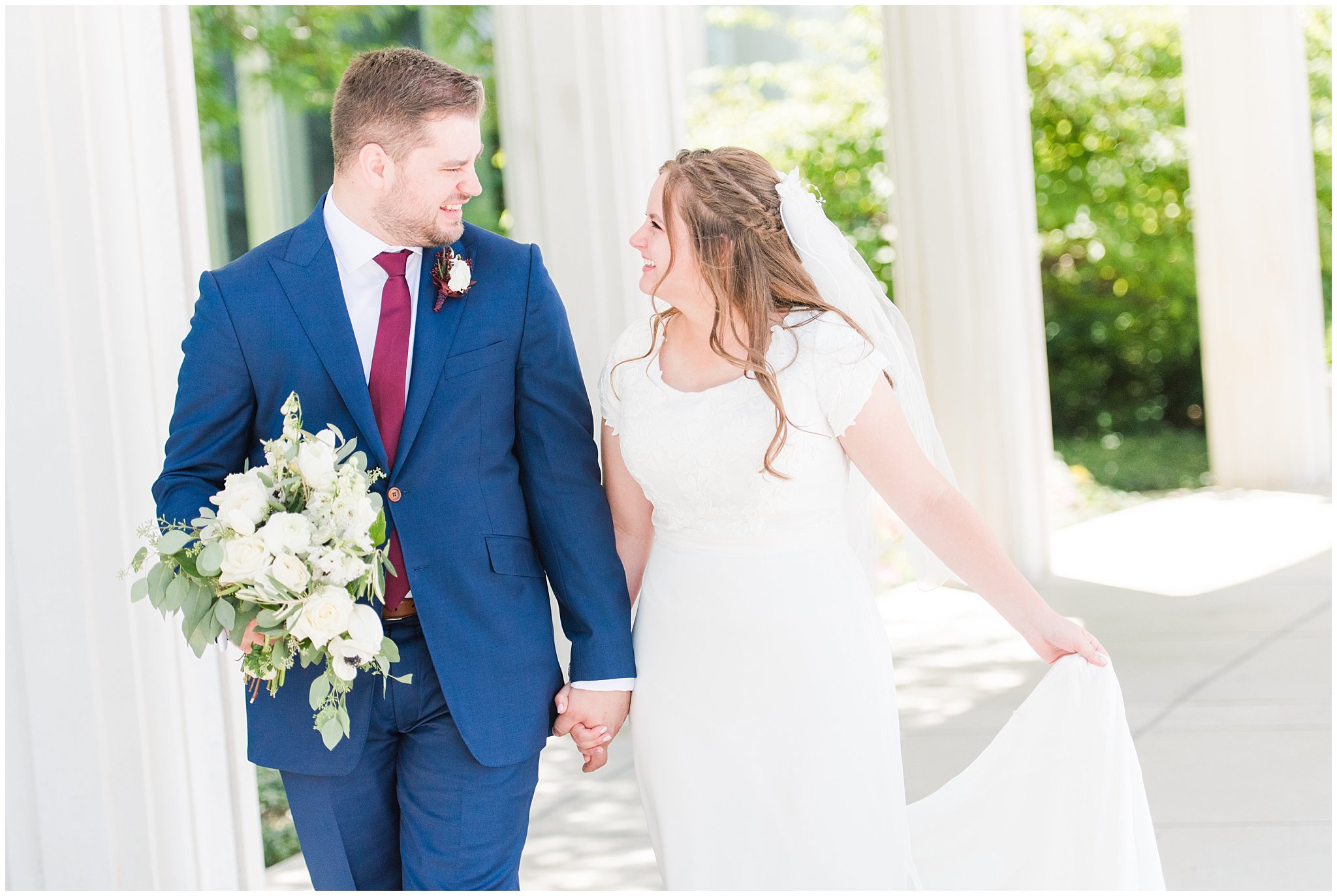 Bride in elegant lace dress, white anemones bouquet, and vintage veil and groom in navy suit with wine colored tie | Summer Bountiful Temple Wedding | Jessie and Dallin Photography