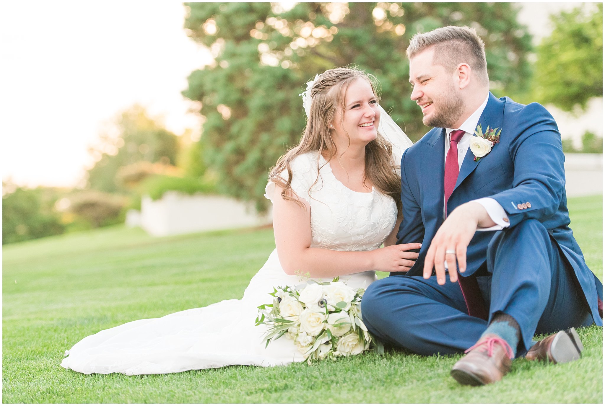 Bride in elegant lace dress, white anemones bouquet, and vintage veil and groom in navy suit with wine colored tie | Summer Bountiful Temple Wedding | Jessie and Dallin Photography