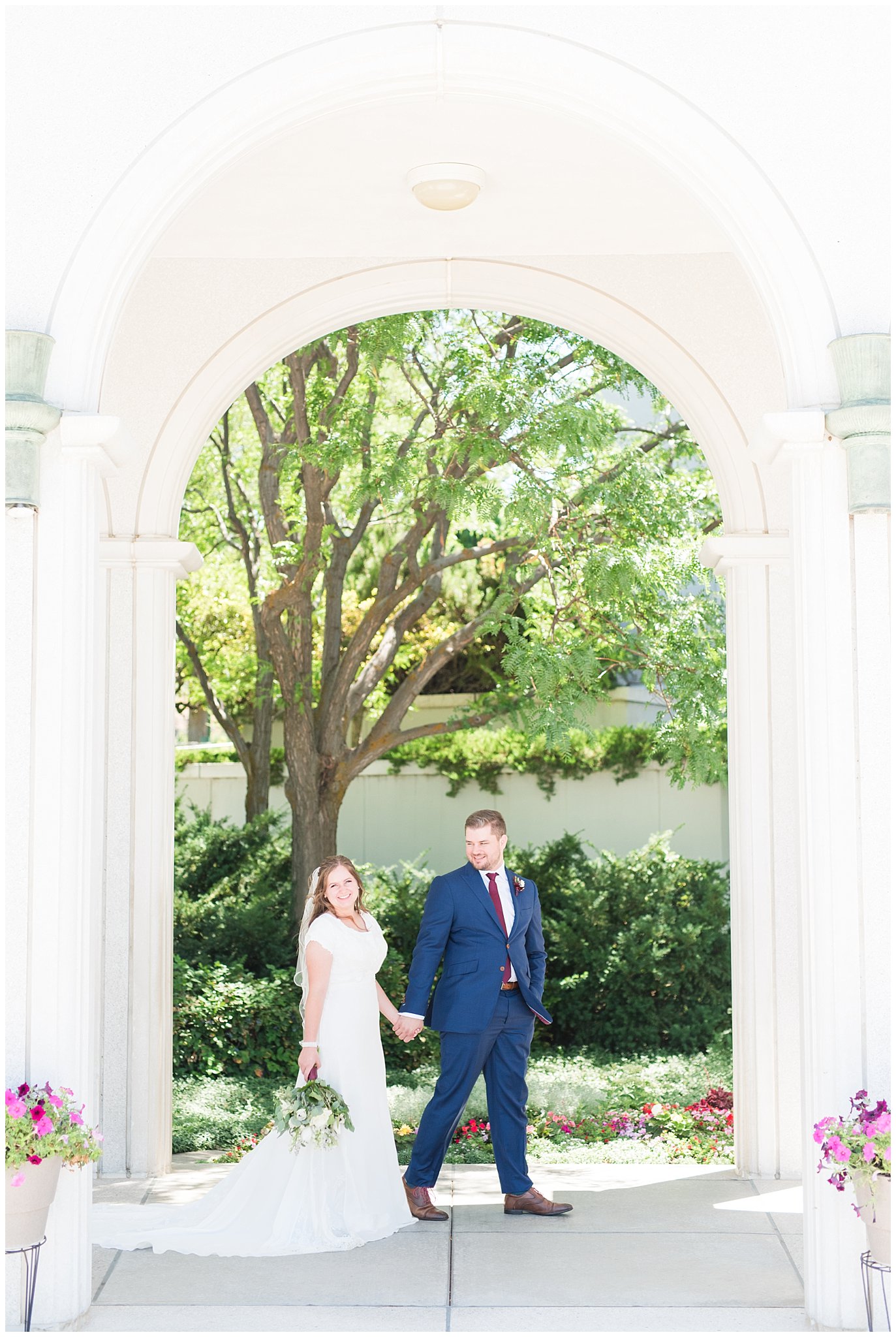 Bride in elegant lace dress, white anemones bouquet, and vintage veil and groom in navy suit with wine colored tie | Summer Bountiful Temple Wedding | Jessie and Dallin Photography