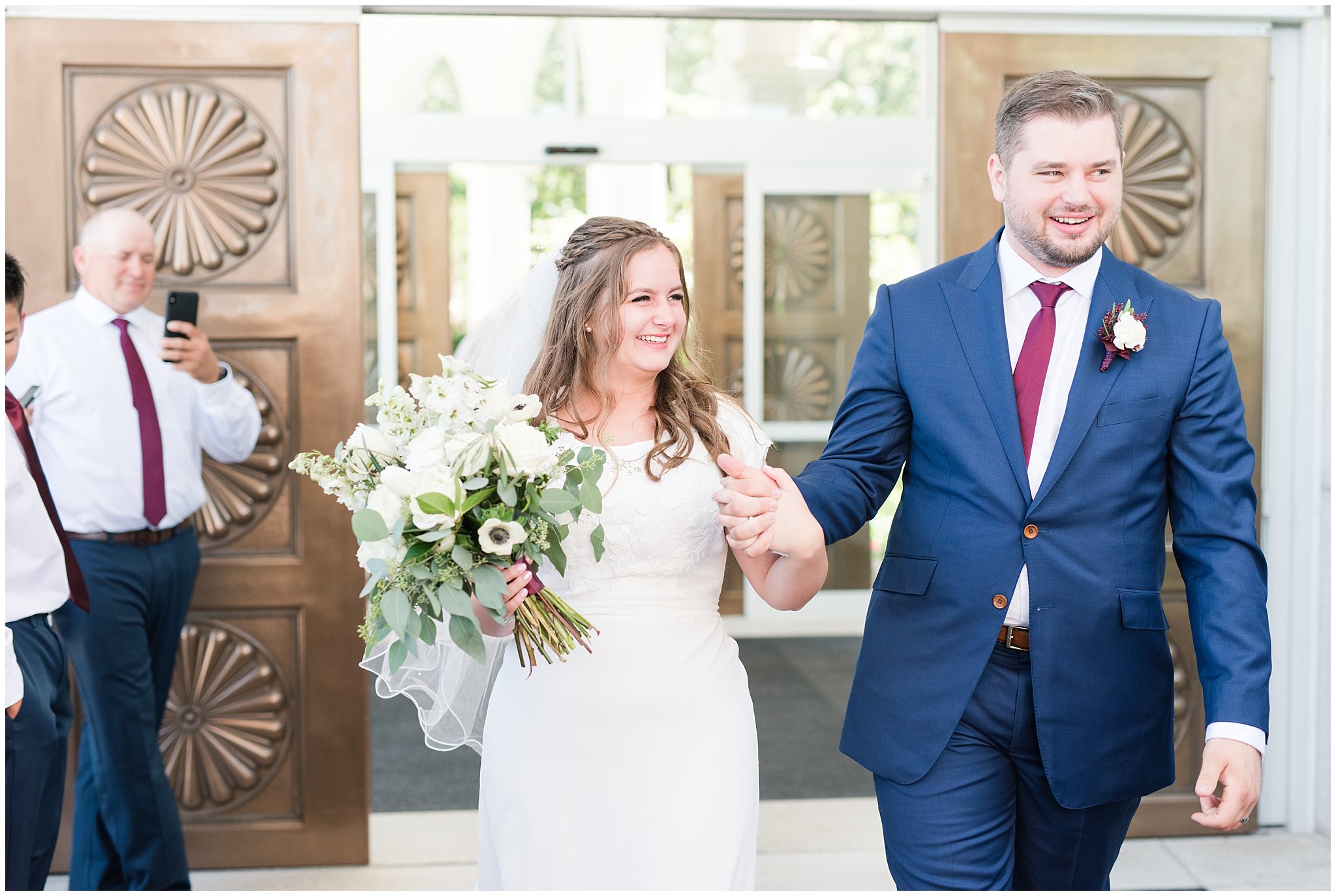 Bride in elegant lace dress, white anemones bouquet, and vintage veil and groom in navy suit with wine colored tie | Summer Bountiful Temple Wedding | Jessie and Dallin Photography