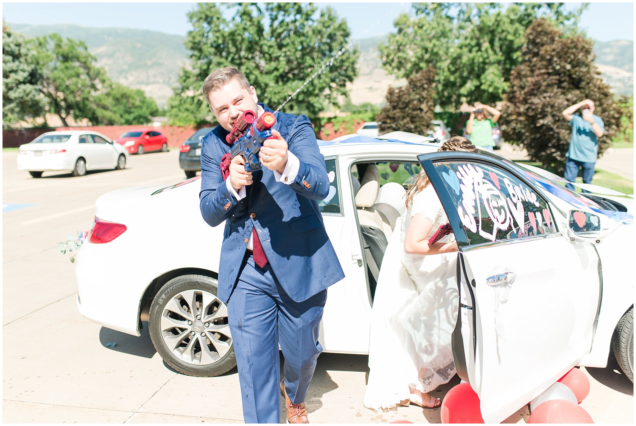 Squirt gun, water gun wedding exit sendoff | Navy and wine wedding | Summer Bountiful Temple Wedding | Jessie and Dallin Photography