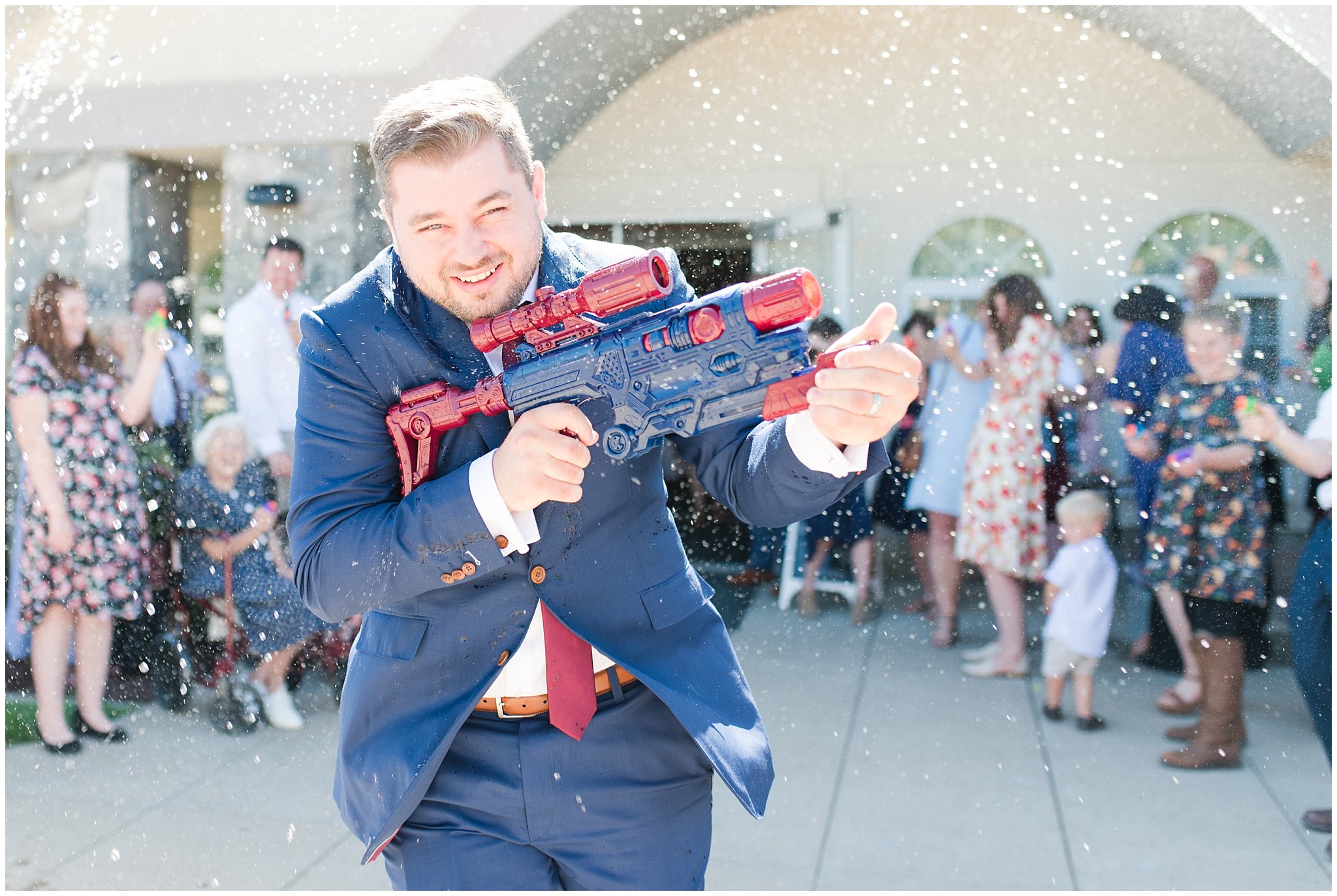 Squirt gun, water gun wedding exit sendoff | Navy and wine wedding | Summer Bountiful Temple Wedding | Jessie and Dallin Photography