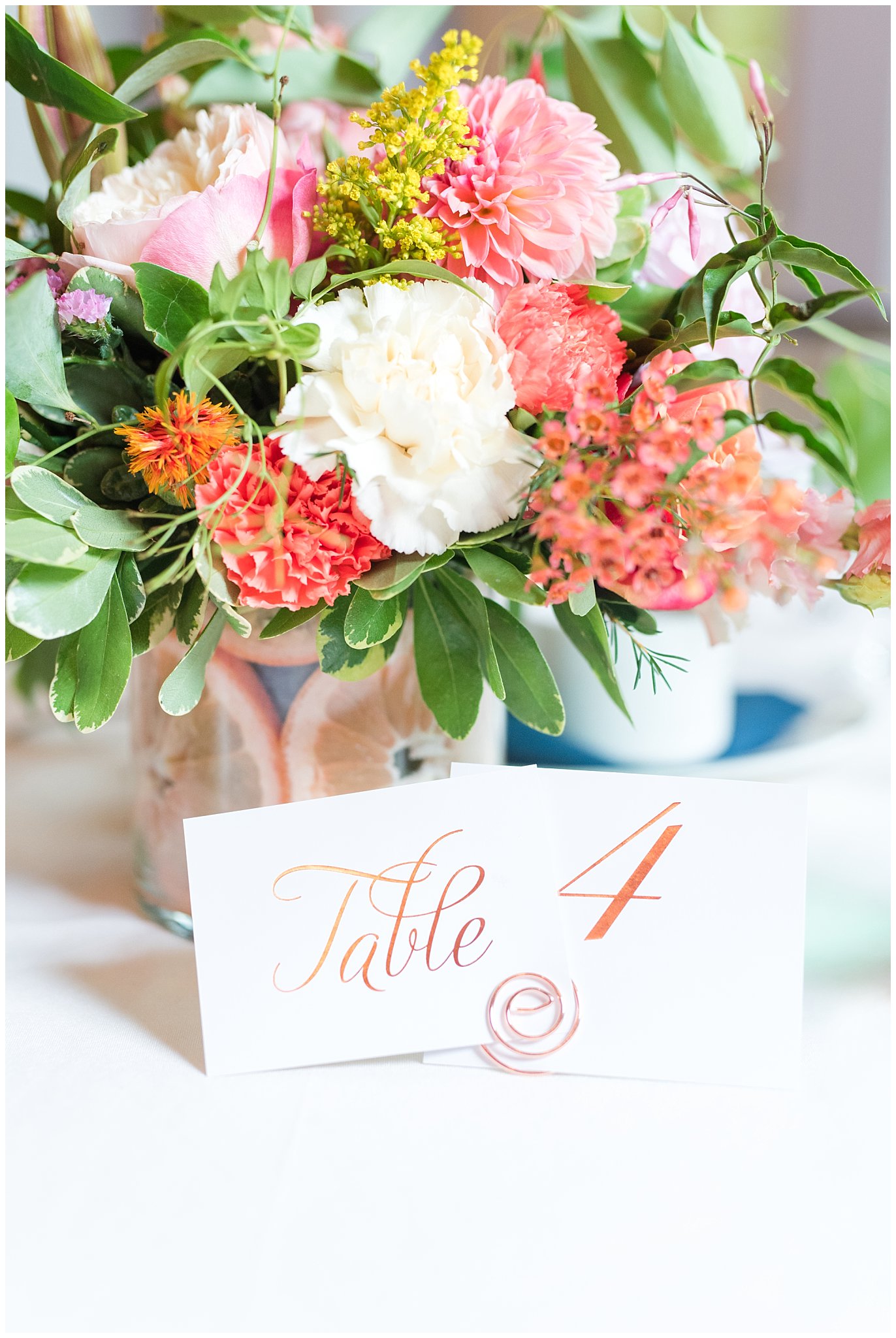 Reception setup with orange uplighting | butterfly wedding with sunset colors | Park City Wedding at the Hyatt Centric | Jessie and Dallin Photography