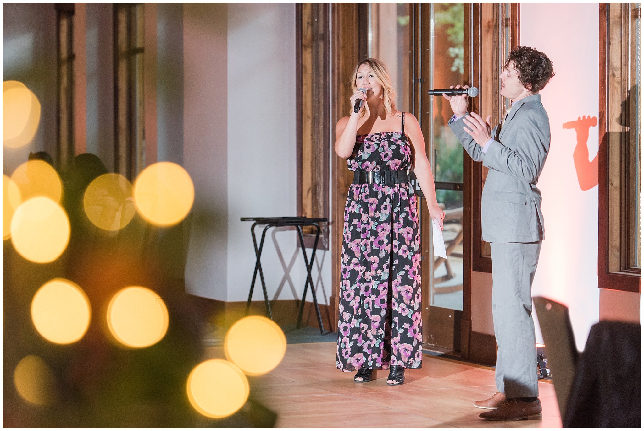 Orange uplighting reception with theater performers | Park City Wedding at the Hyatt Centric | Jessie and Dallin Photography