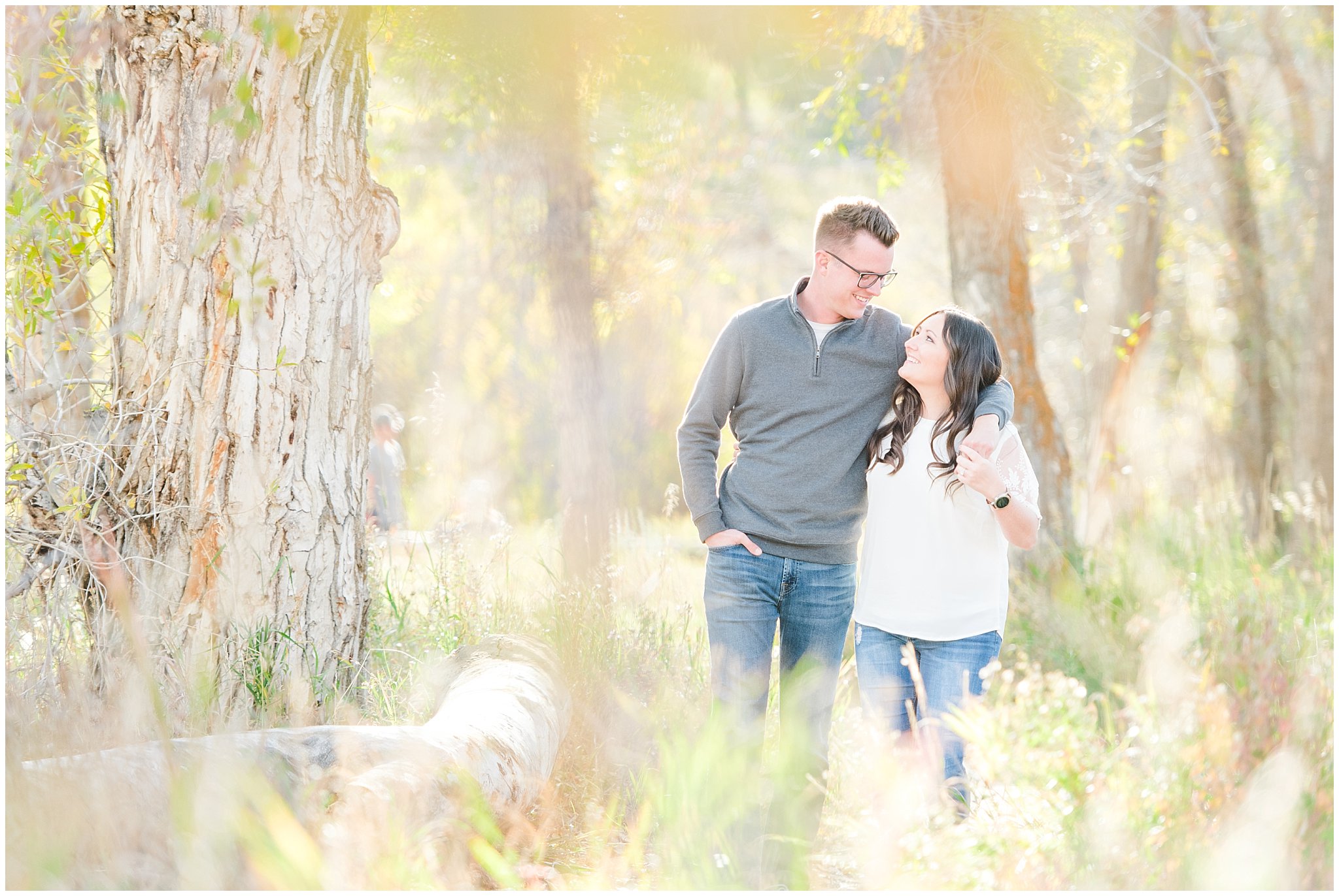 Couple in casual outfit with grey sweater, white top and jeans | Snowbasin woods and fall trees | A Classic Snowbasin Fall Engagement Session | Jessie and Dallin Photography