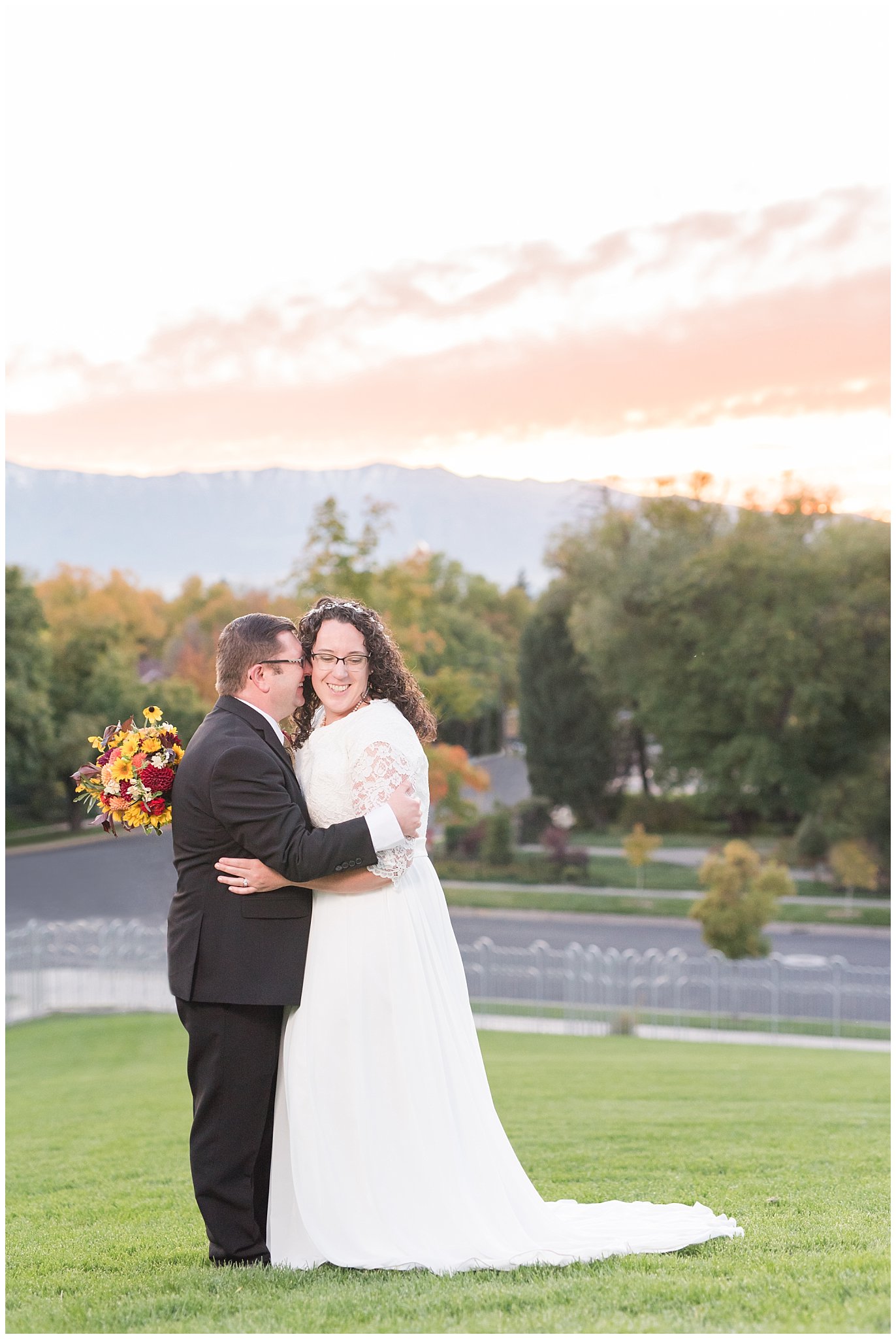 Groom in black suit and gold tie, bride in simple lace sleeve wedding dress with fall bouquet | Logan sunset | Logan Temple Fall Formal Session | Jessie and Dallin Photography