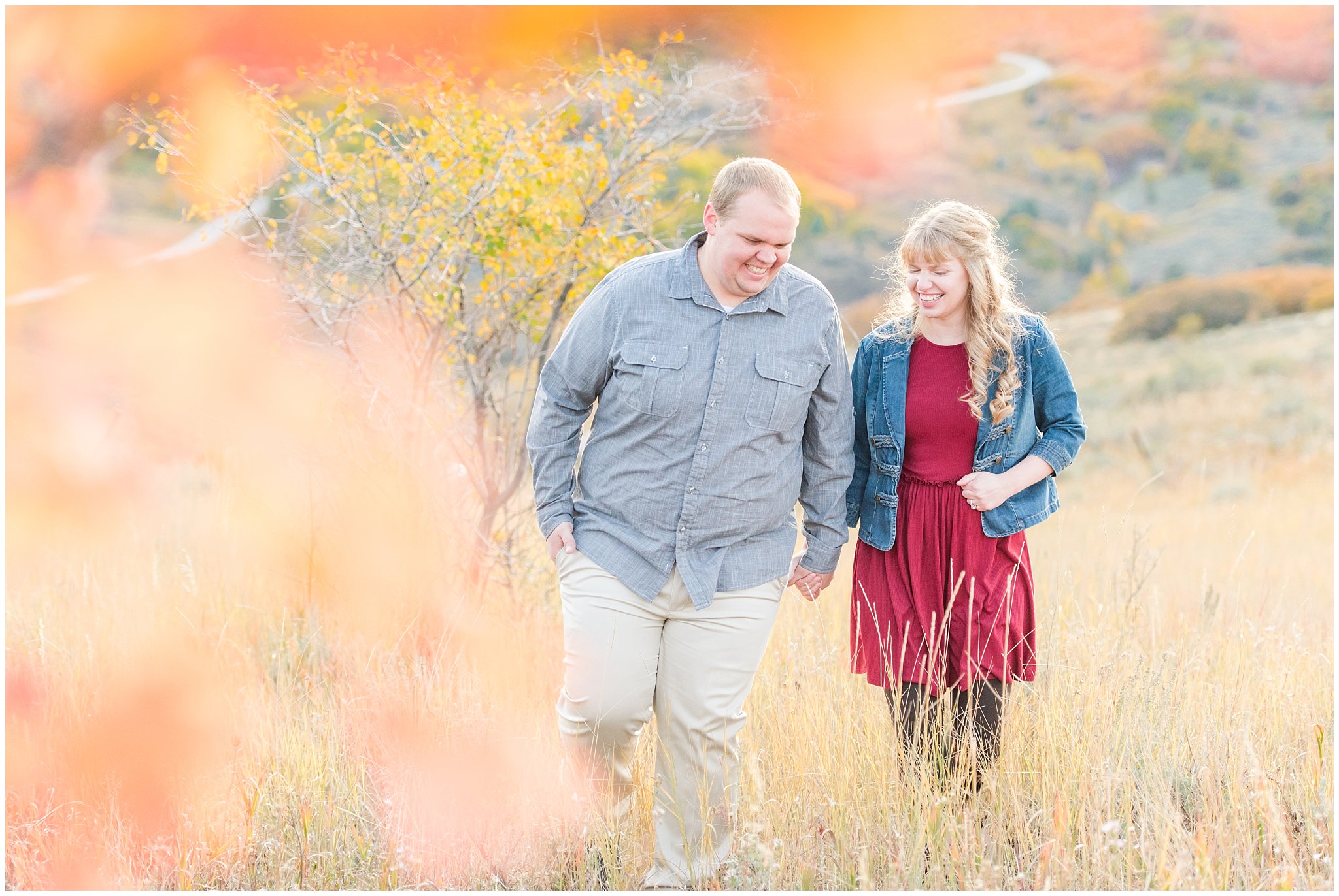 Couple dressed up with girl in burgundy dress with jean jacket and guy in grey shirt and light colored pants | Mountain engagement | Trapper's Loop Fall Engagement Session | Snowbasin Utah Mountains | Jessie and Dallin Photography