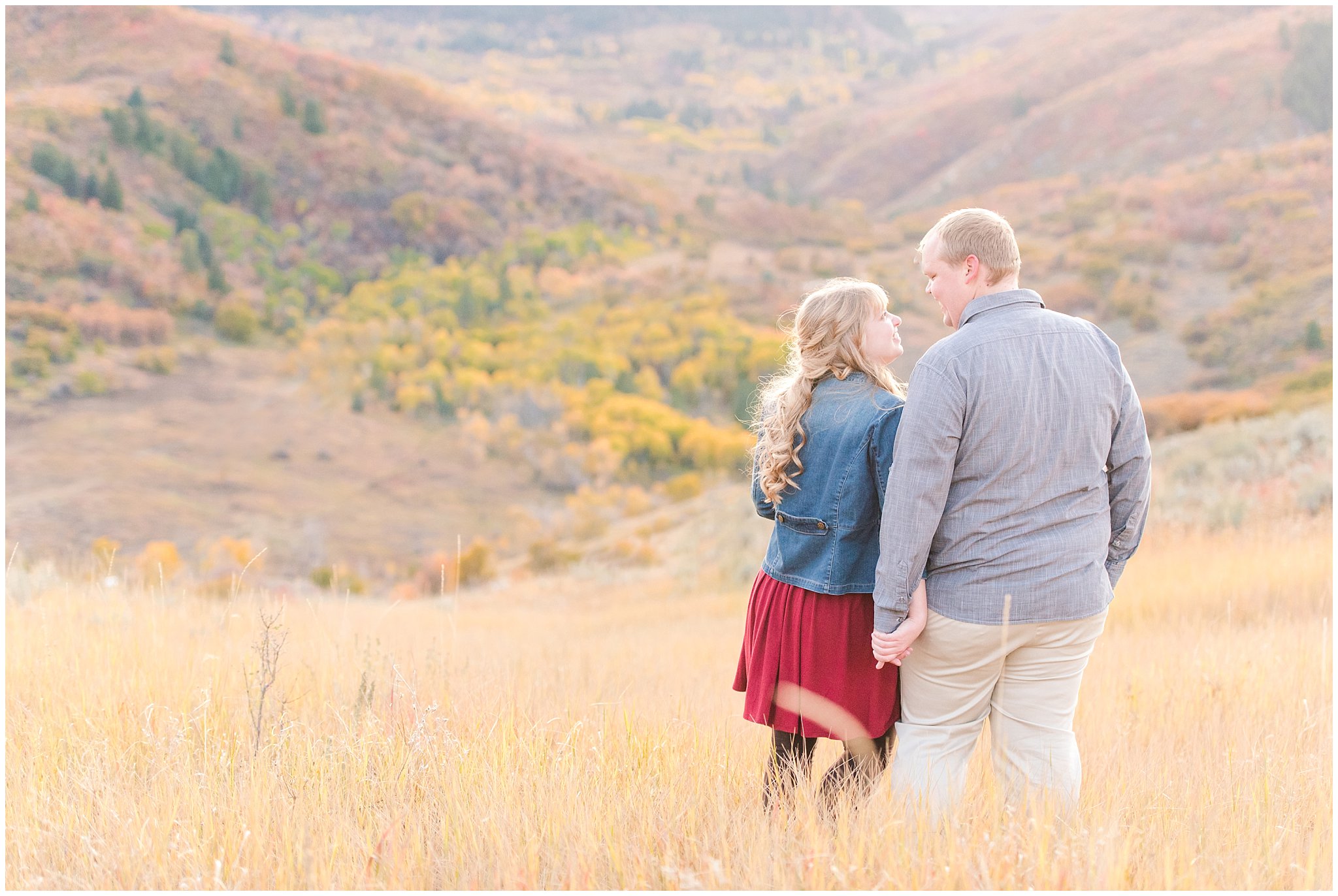 Couple dressed up with girl in burgundy dress with jean jacket and guy in grey shirt and light colored pants | Mountain engagement | Trapper's Loop Fall Engagement Session | Snowbasin Utah Mountains | Jessie and Dallin Photography