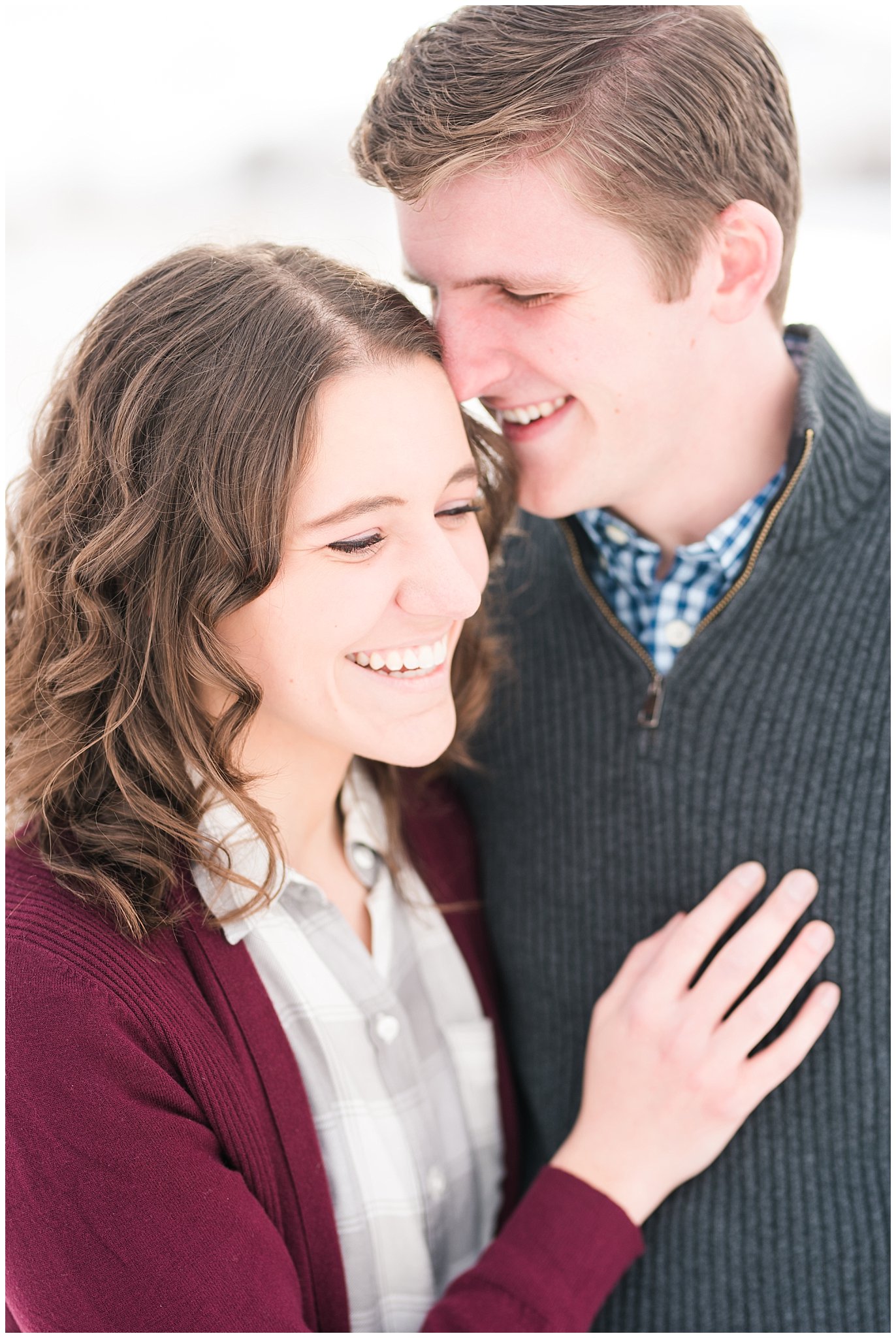 Snowy engagement session with couple in sweaters and boots in the mountains | Snowbasin Winter Engagement Session