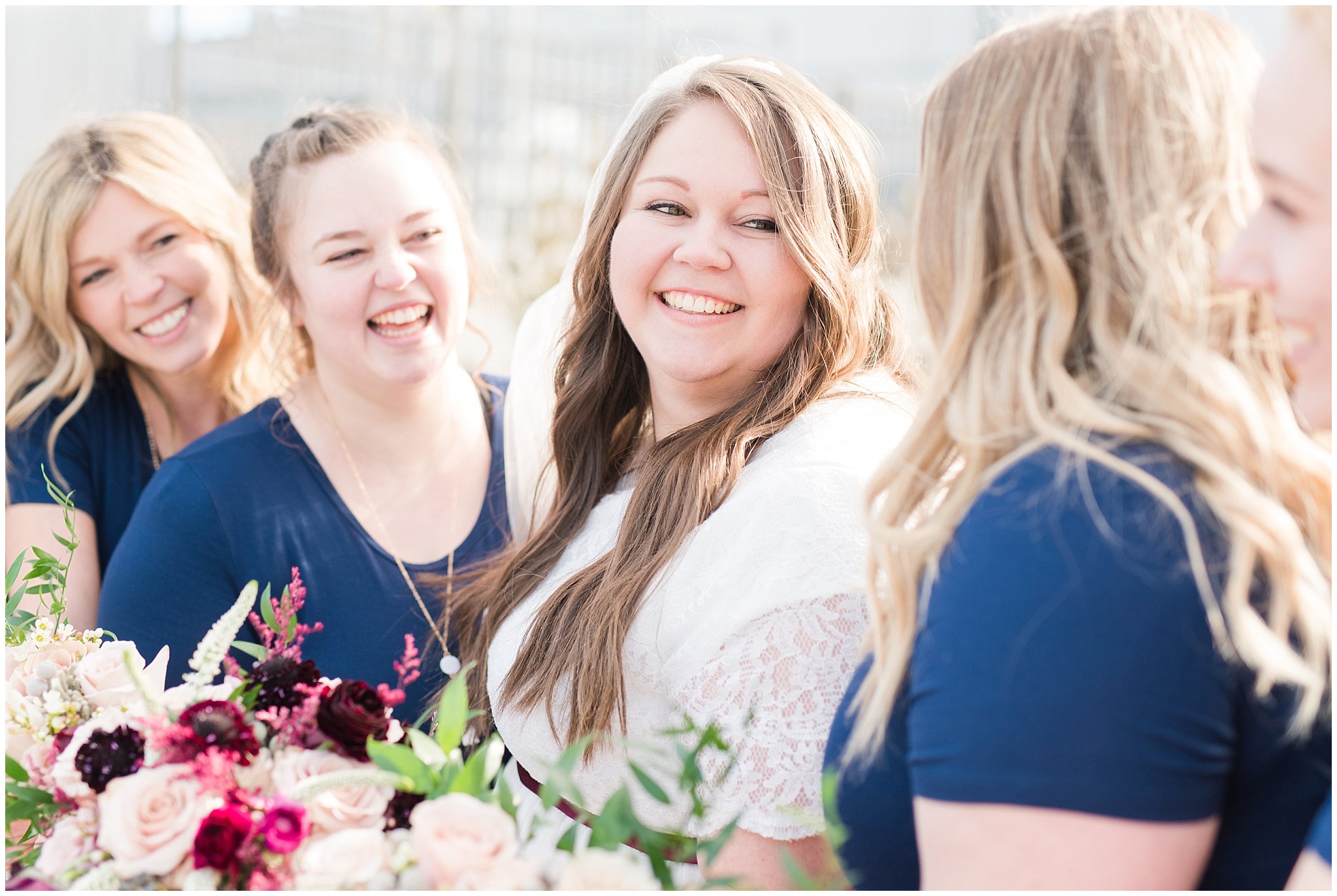 Bridal party photos in navy maxi dresses and burgundy ties at the Jordan River Temple | Burgundy and quicksand rose bouquets | Jordan River Temple Winter Wedding | Jessie and Dallin Photography