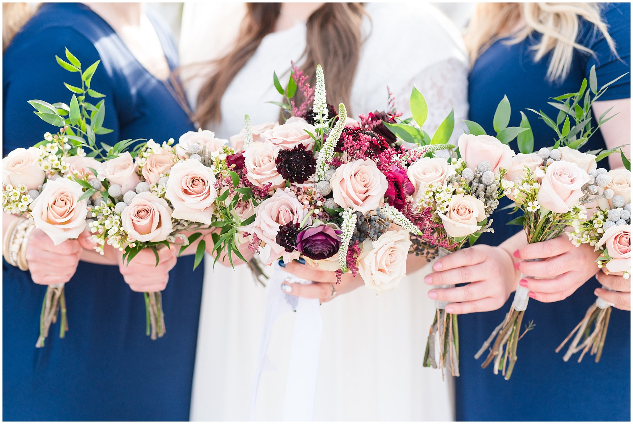 Bridal party photos in navy maxi dresses and burgundy ties at the Jordan River Temple | Burgundy and quicksand rose bouquets | Jordan River Temple Winter Wedding | Jessie and Dallin Photography