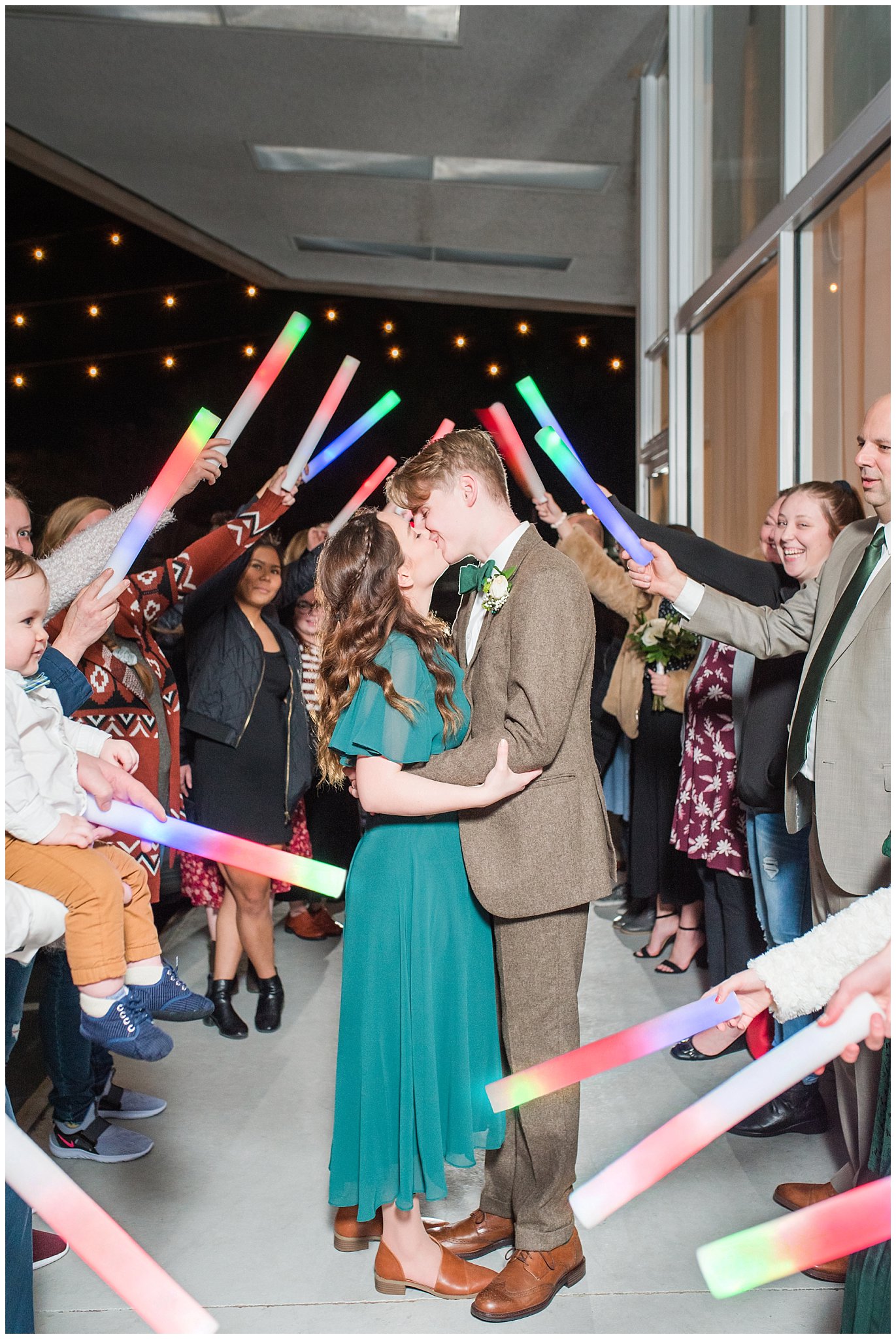 Lightsaber sendoff exit at Sweet Magnolia Venues | Brown, Emerald Green, and white wedding | Ogden Temple and Sweet Magnolia Wedding | Jessie and Dallin Photography