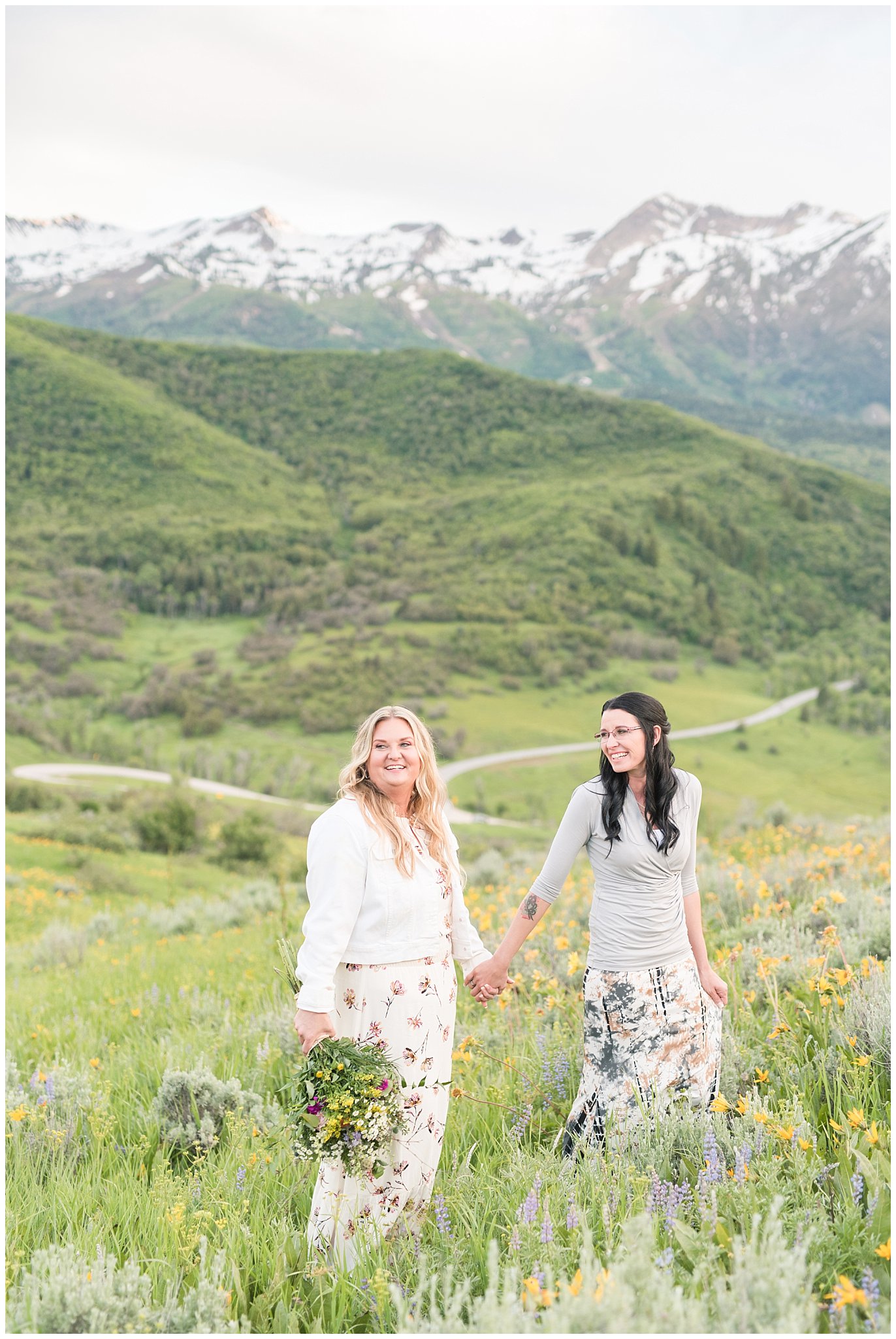 Couple walks with bouquet in front of snow capped mountains | Top Utah Wedding and Couples Photos 2019 | Jessie and Dallin Photography