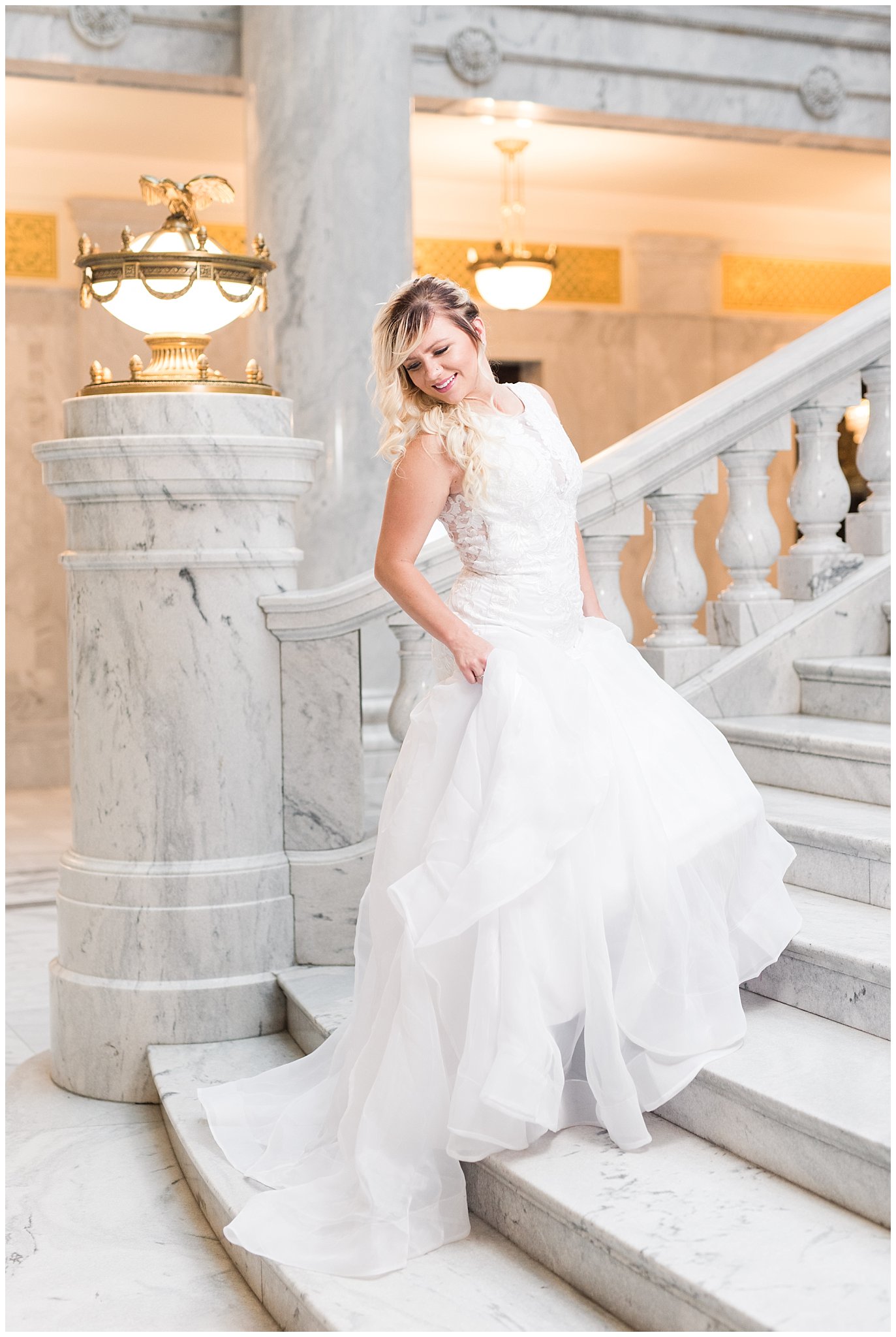 Bride climbs indoor stairs at the Utah State Capitol Building | Top Utah Wedding and Couples Photos 2019 | Jessie and Dallin Photography