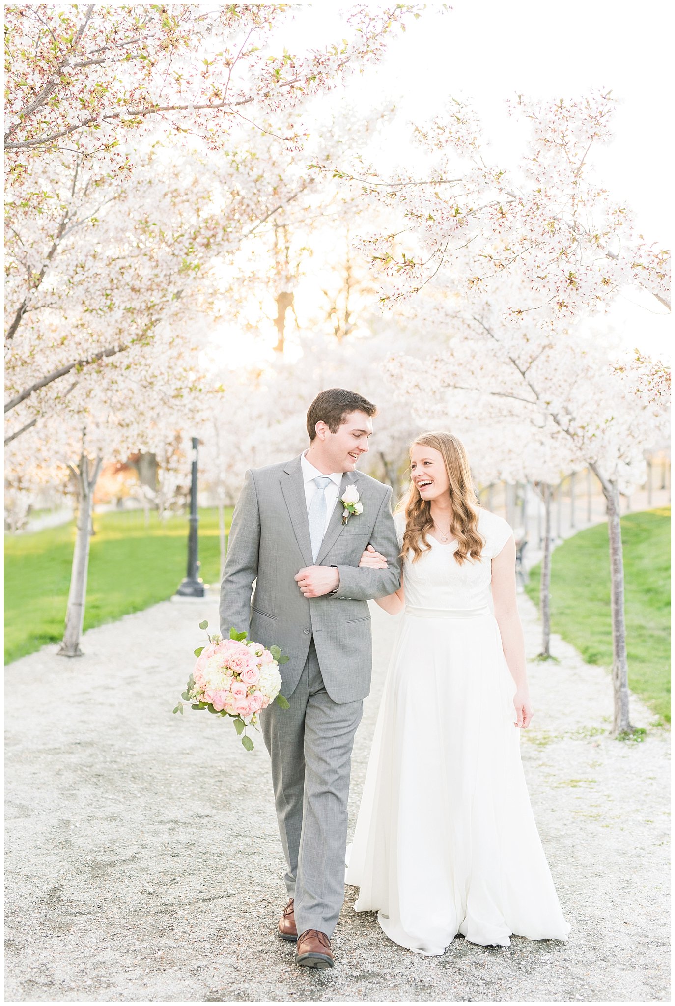 Bride and groom walking through the blossoms at the Utah State Capitol | Top Utah Wedding and Couples Photos 2019 | Jessie and Dallin Photography