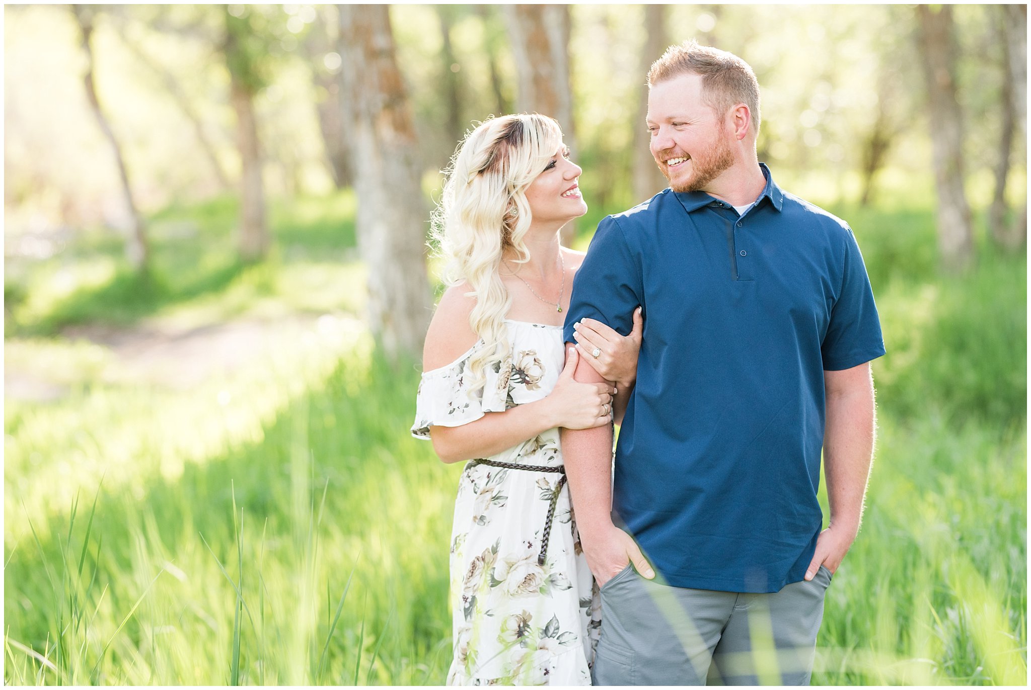 Couple stands in tall green grasses in the Utah mountains during engagement session | Top Utah Wedding and Couples Photos 2019 | Jessie and Dallin Photography
