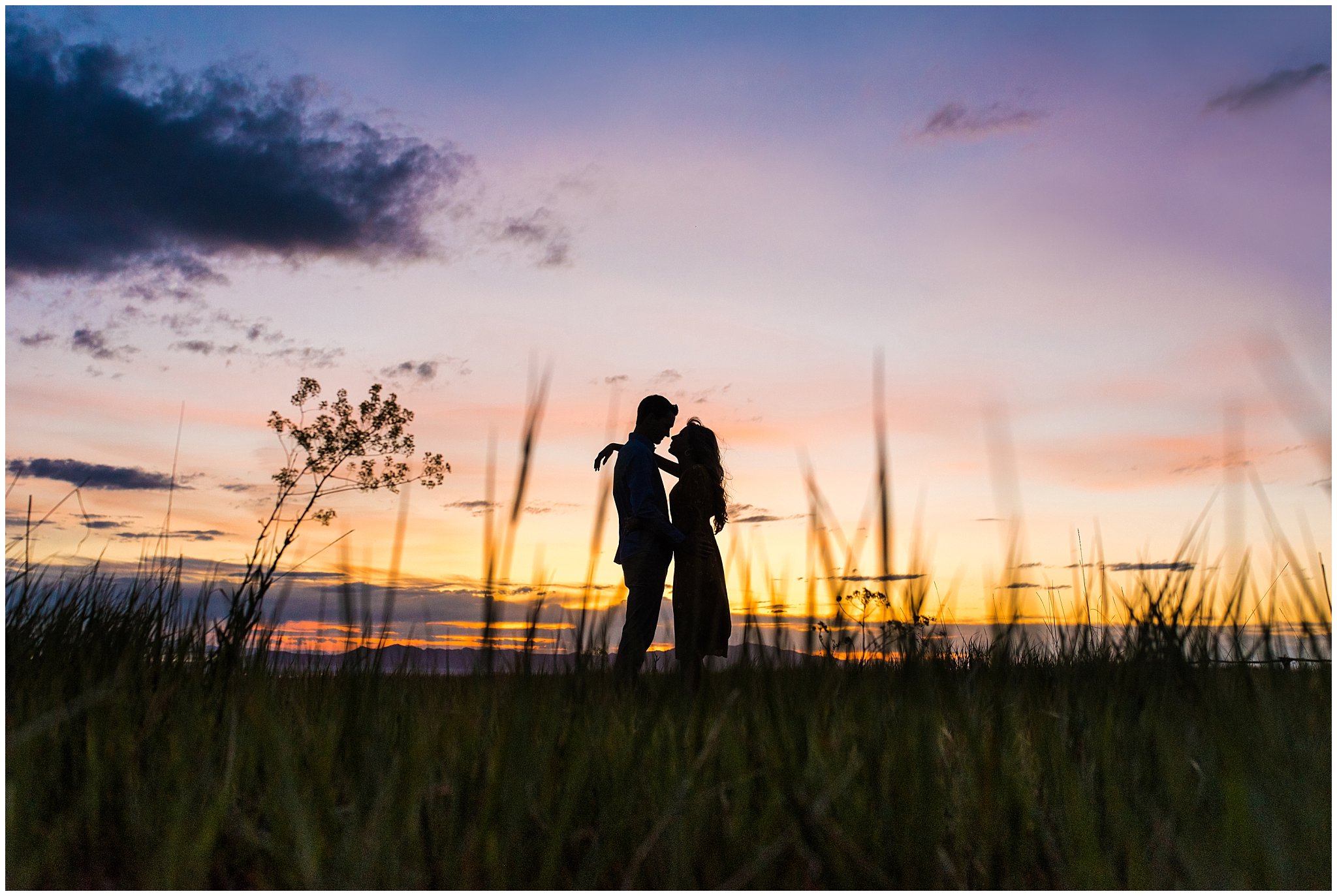 Sunset Silhouette of a couple on a mountain side | Utah State Capitol and Tunnel Springs Engagement Session | Jessie and Dallin Photography