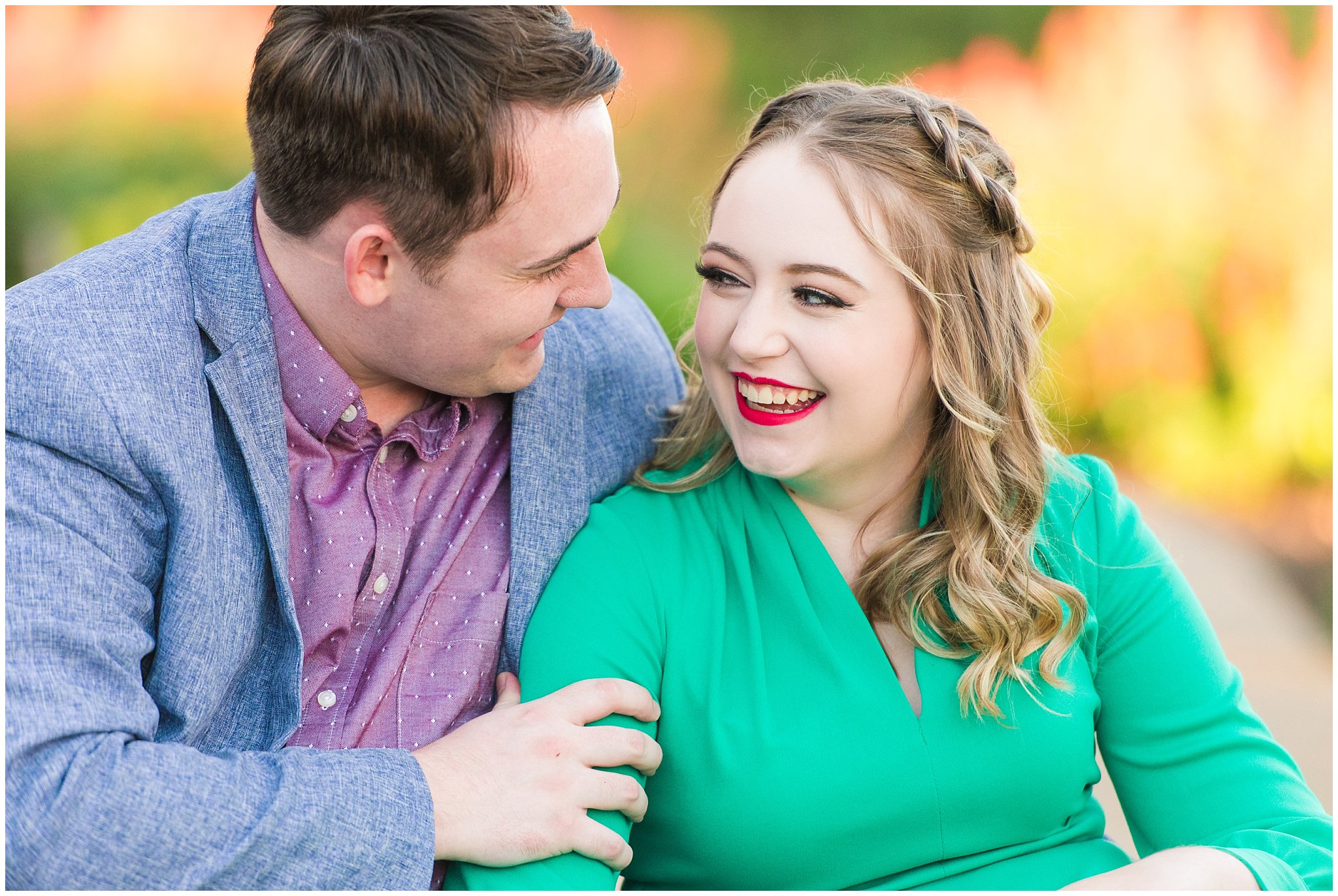 Couple in a garden for their engagement session with a vintage 1950s dress | Summer USU Botanical Garden Engagement Session | Jessie and Dallin Photography