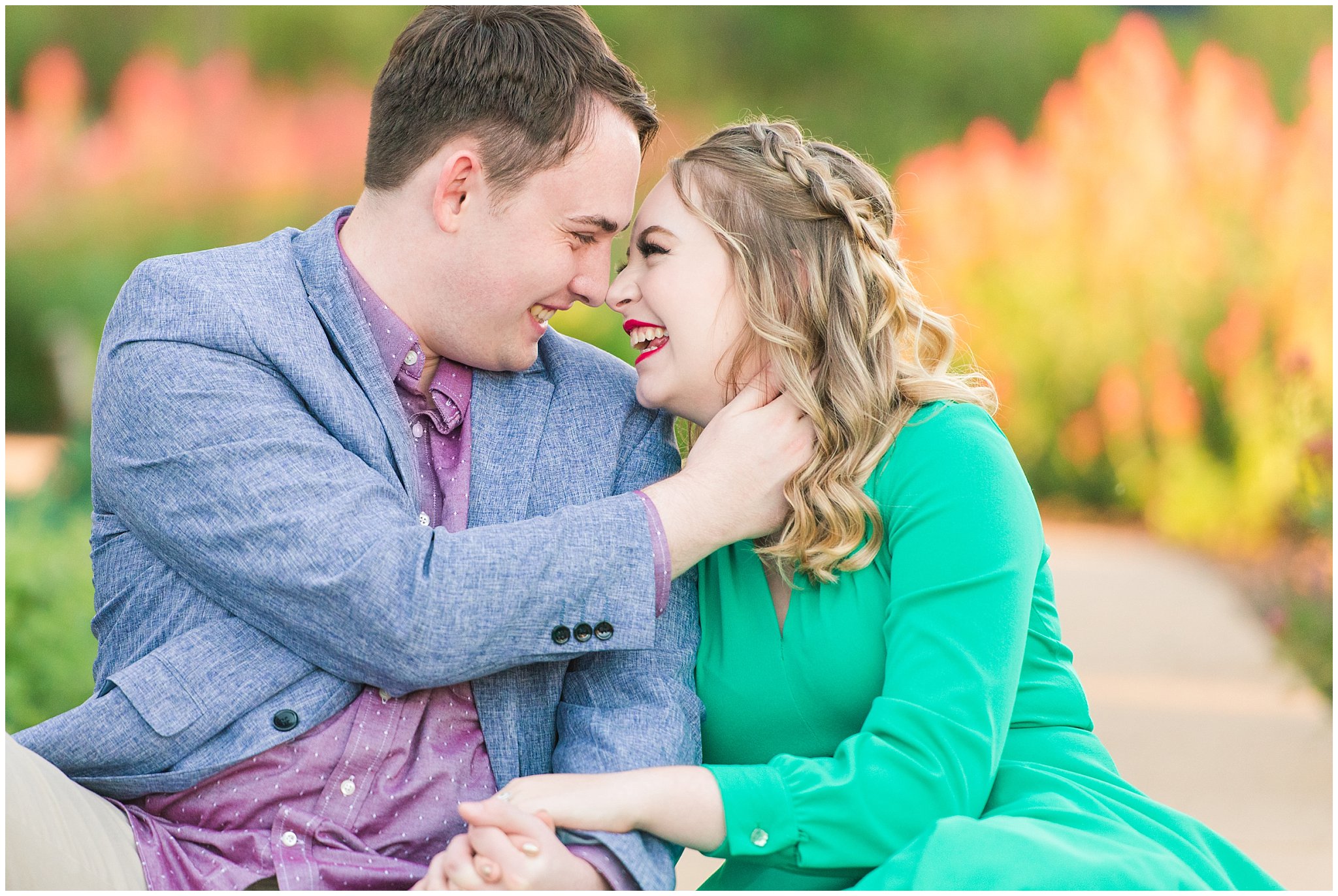 Couple in a garden for their engagement session with a vintage 1950s dress | Summer USU Botanical Garden Engagement Session | Jessie and Dallin Photography