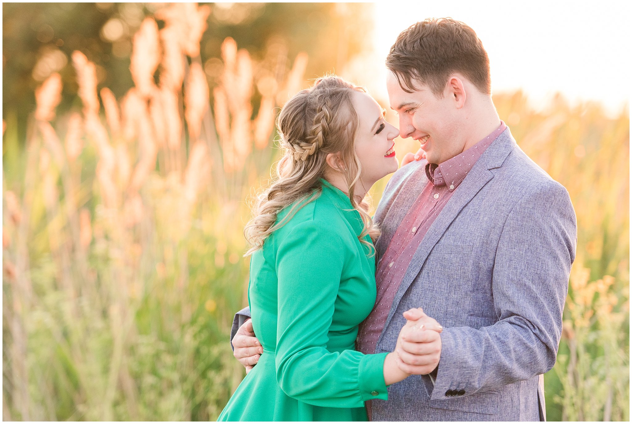 Couple in a garden for their engagement session with a vintage 1950s dress | Summer USU Botanical Garden Engagement Session | Jessie and Dallin Photography