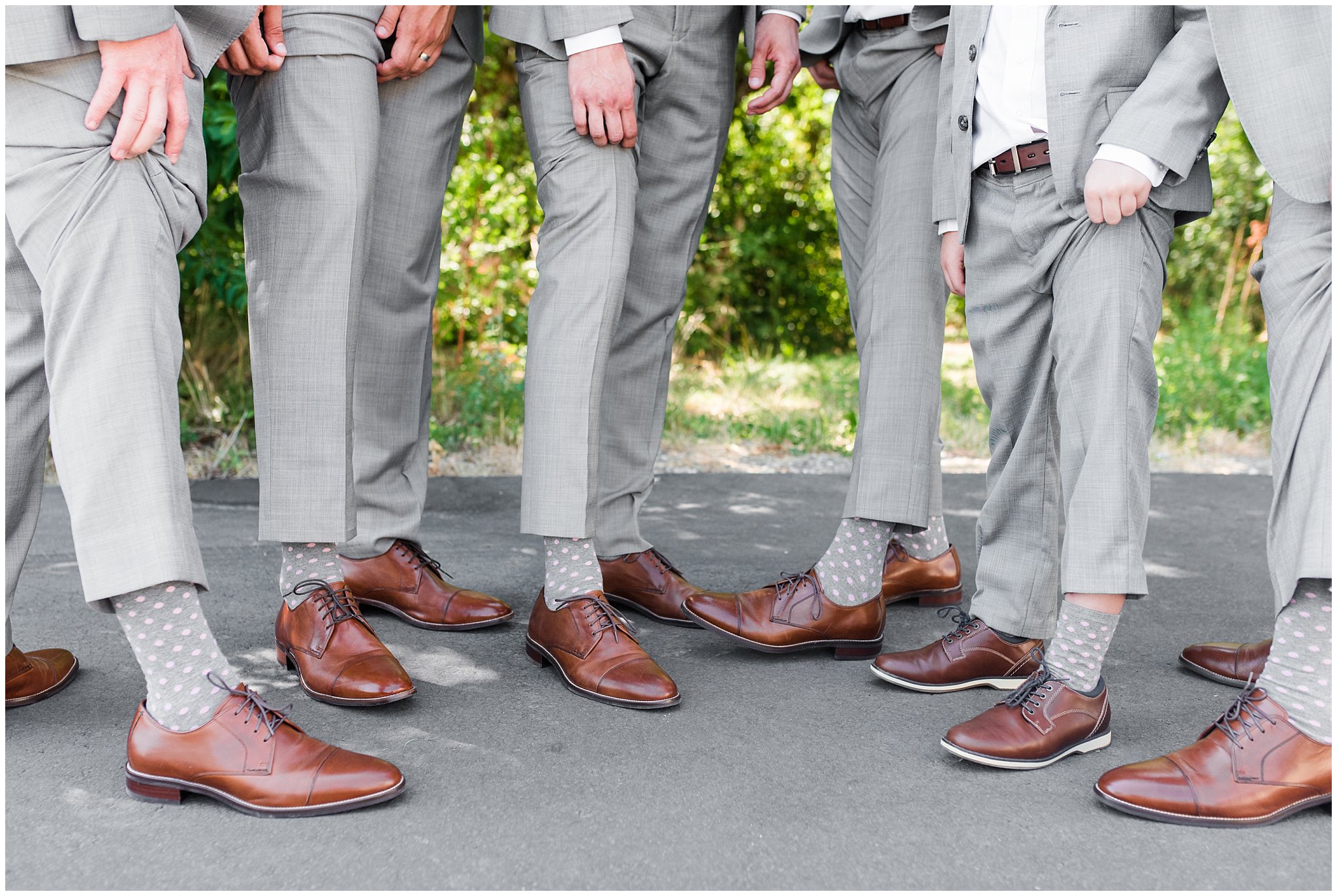 Groomsmen in gray suits and gray socks with pink polka dots | Oak Hills Utah Dusty Rose and Gray Summer Wedding | Jessie and Dallin Photography