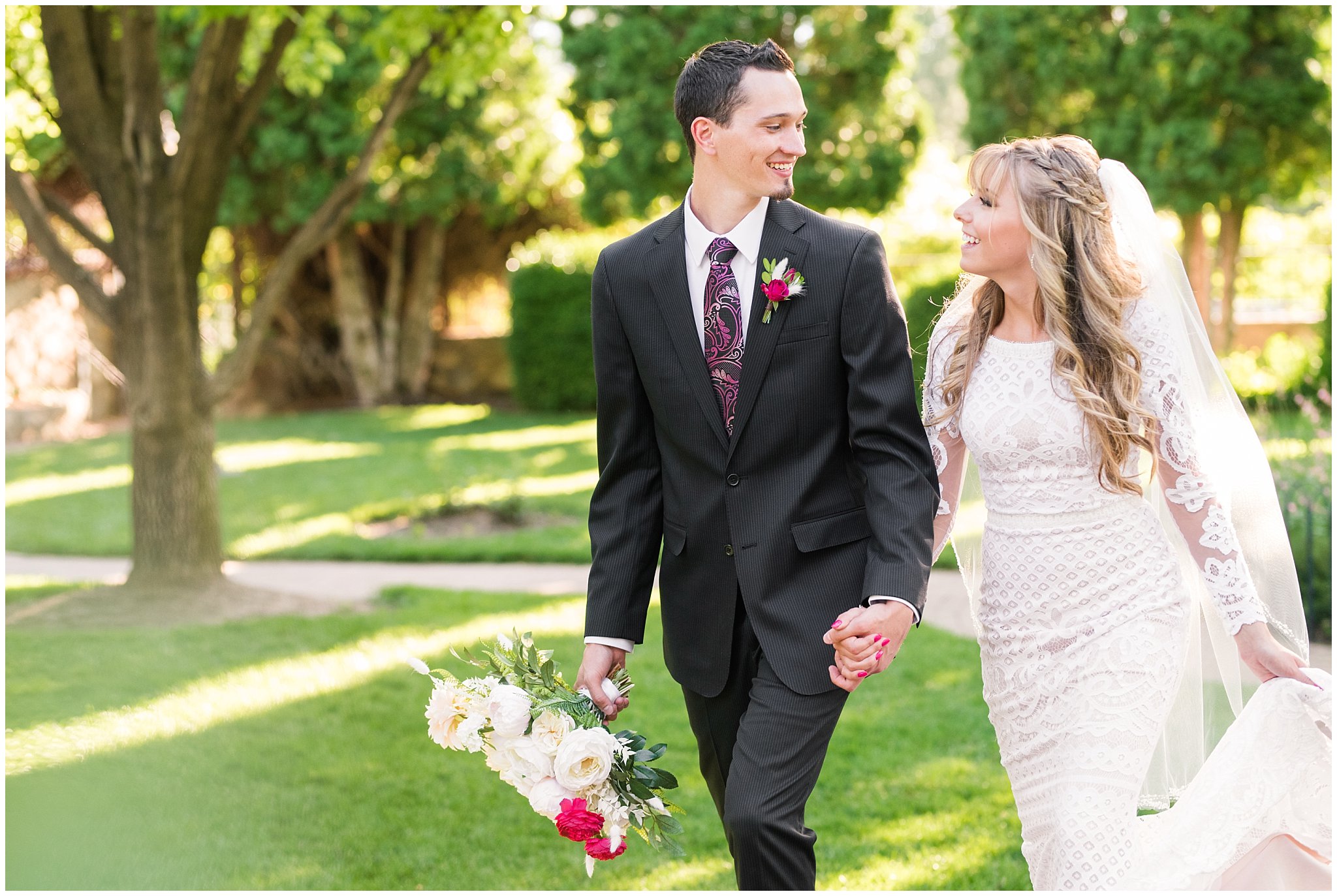 Bride and groom portraits candid moments laughing | white and deep pink florals with black suit and lace dress | Wadley Farms Summer Wedding | Jessie and Dallin Photography