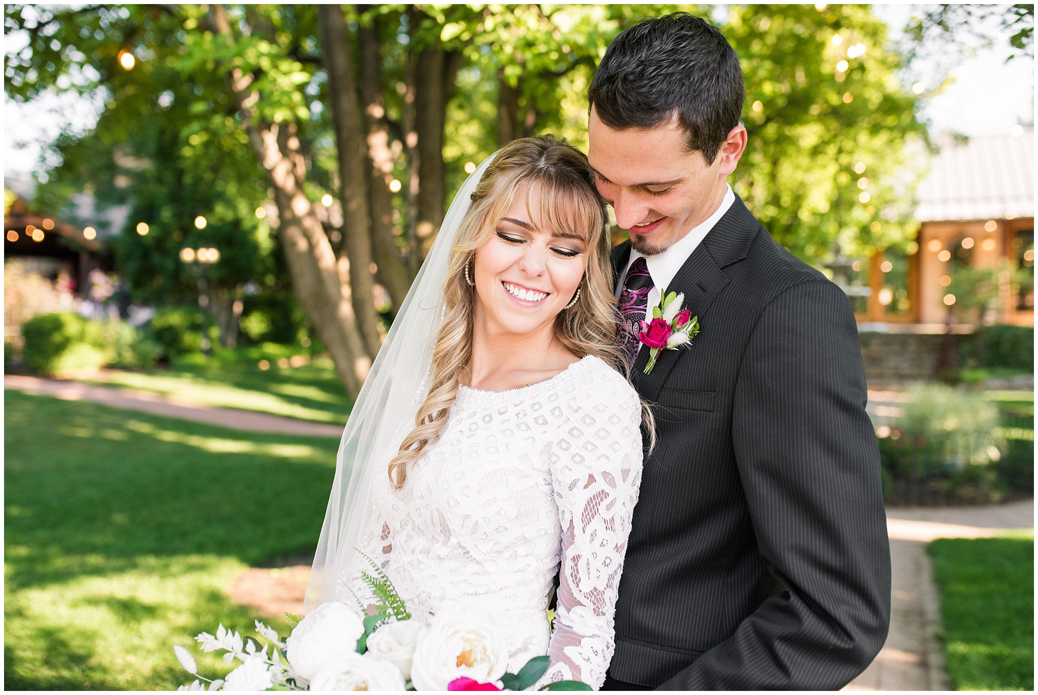 Bride and groom portraits candid moments laughing | white and deep pink florals with black suit and lace dress | Wadley Farms Summer Wedding | Jessie and Dallin Photography