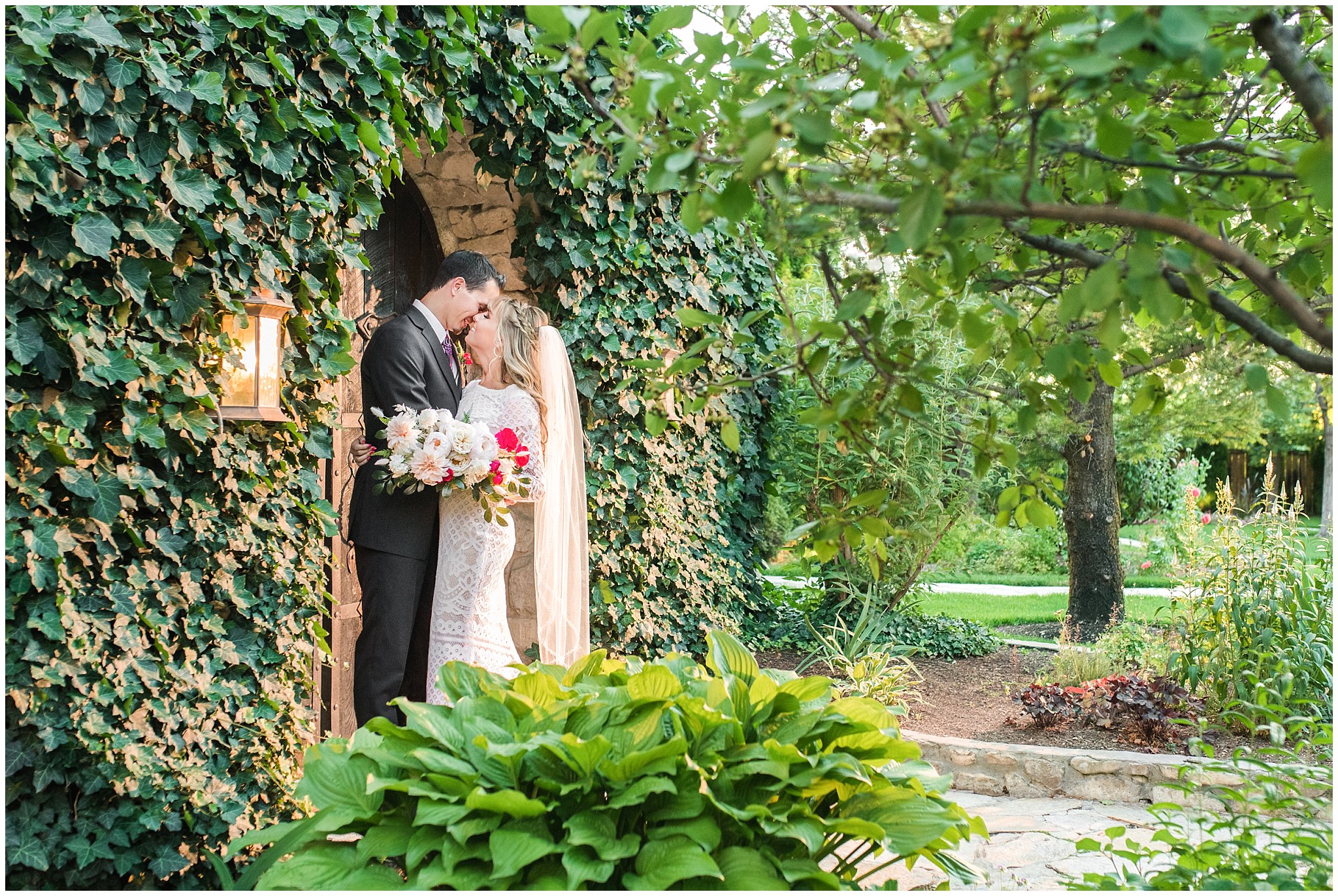 Bride and groom portraits candid moments laughing | white and deep pink florals with black suit and lace dress | Wadley Farms Summer Wedding | Jessie and Dallin Photography