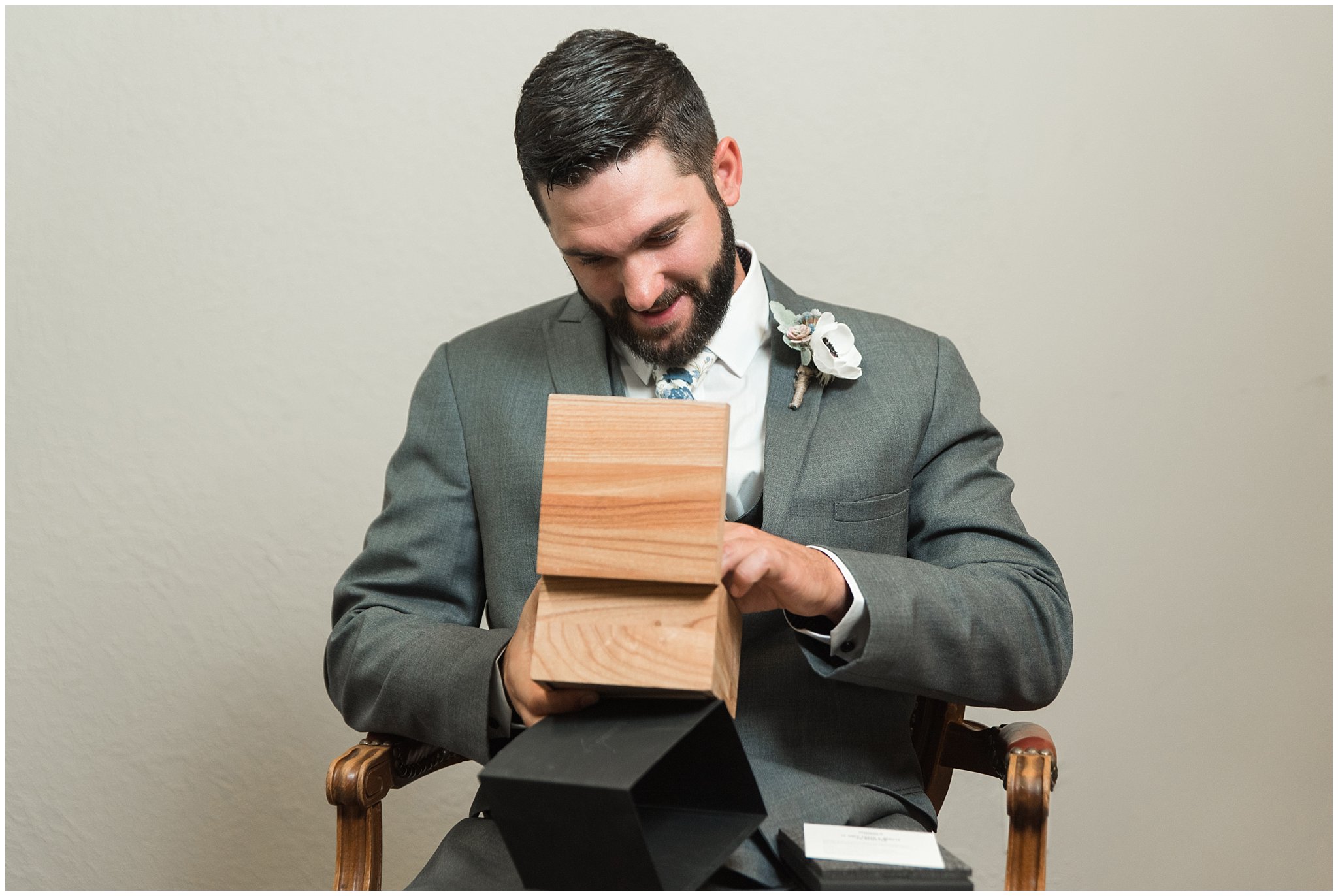 Groom getting ready with a gray suit and blue and white floral tie | Dusty Blue and Rose Summer Wedding at Oak Hills Utah | Jessie and Dallin Photography