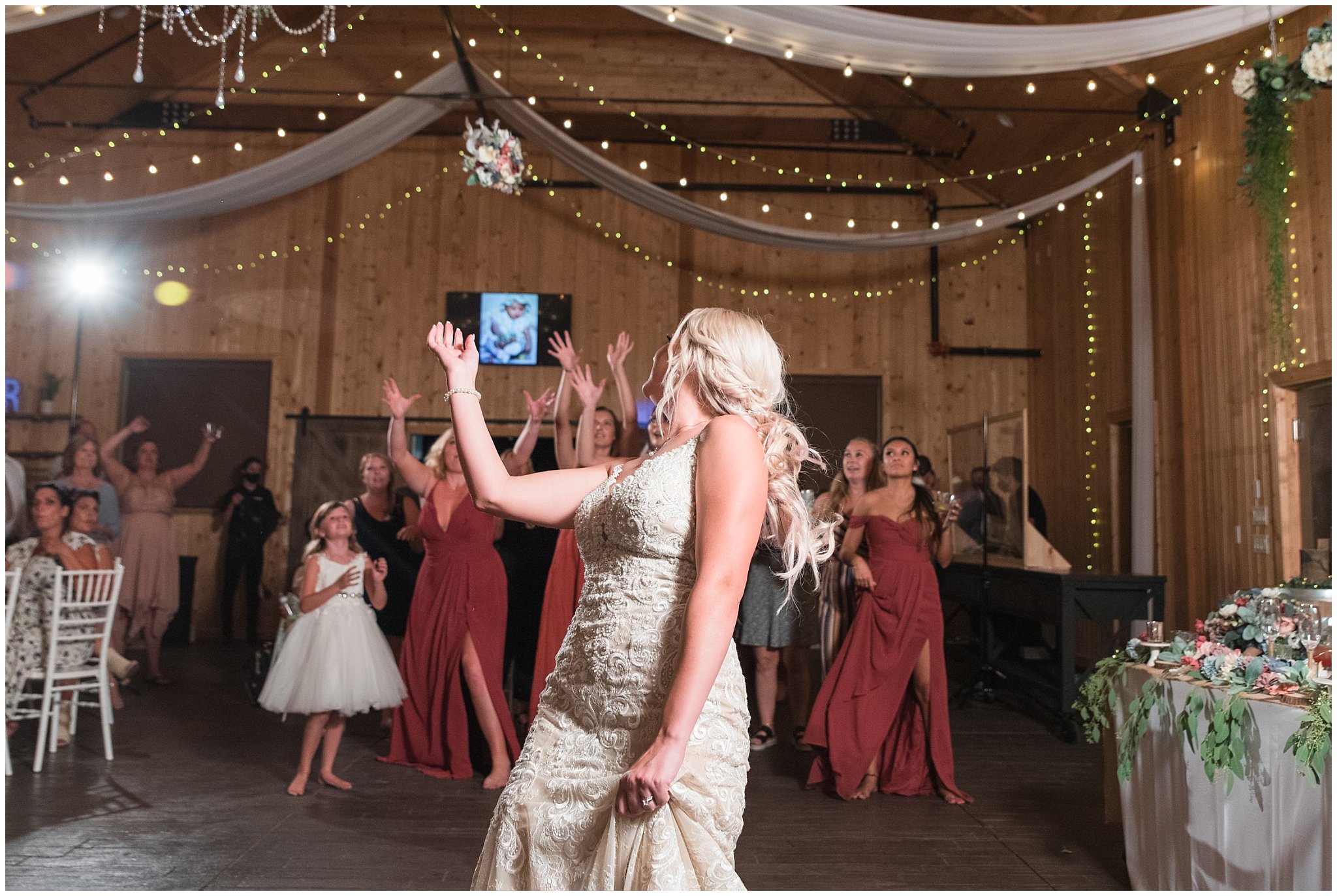 Bouquet toss in barn | Dusty Blue and Rose Summer Wedding at Oak Hills Utah | Jessie and Dallin Photography