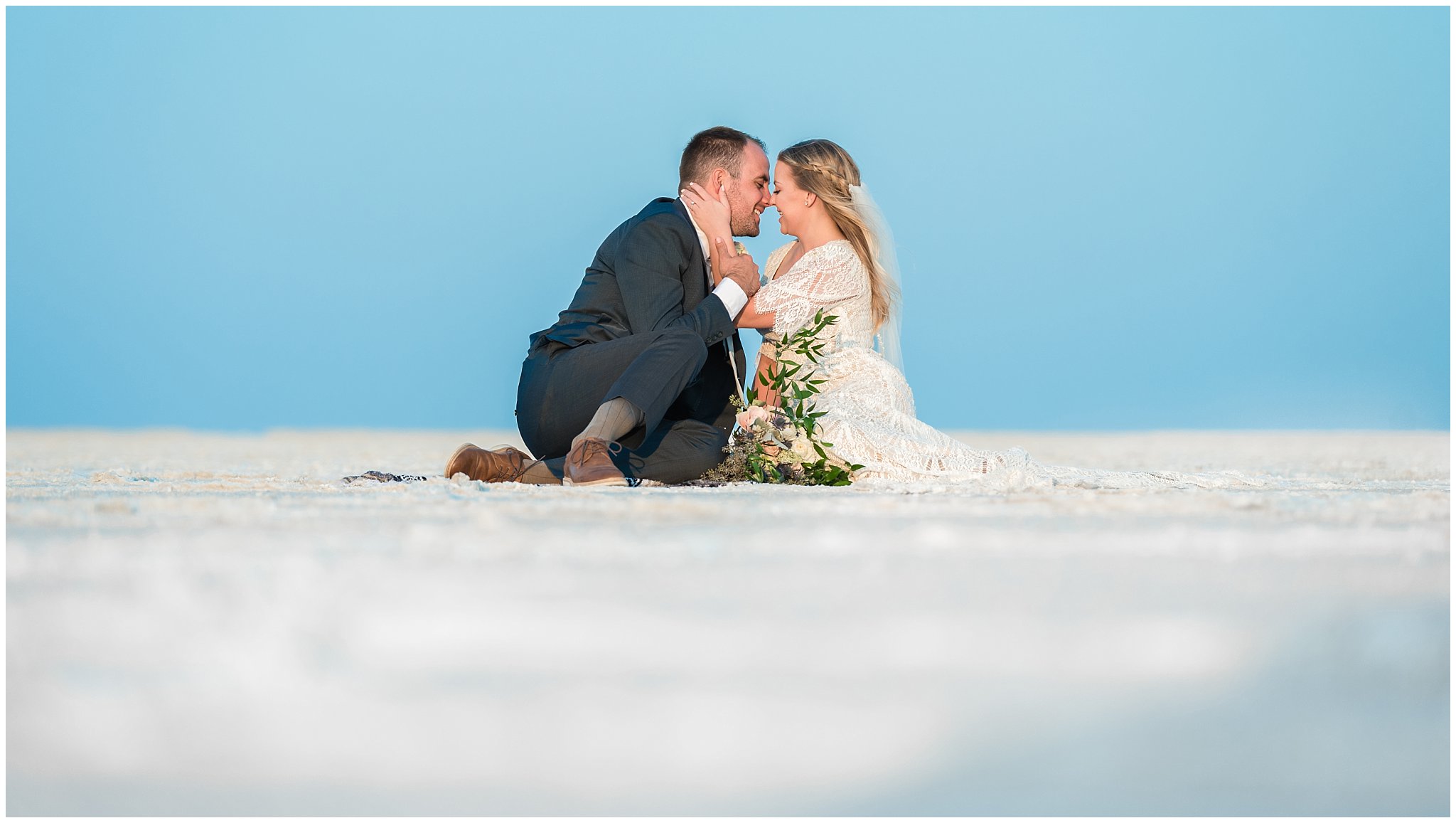 Bride and Groom in lace detail dress and blue suit for Adventure Session | Bonneville Salt Flats Sunset Wedding Formal Session | Jessie and Dallin Photography