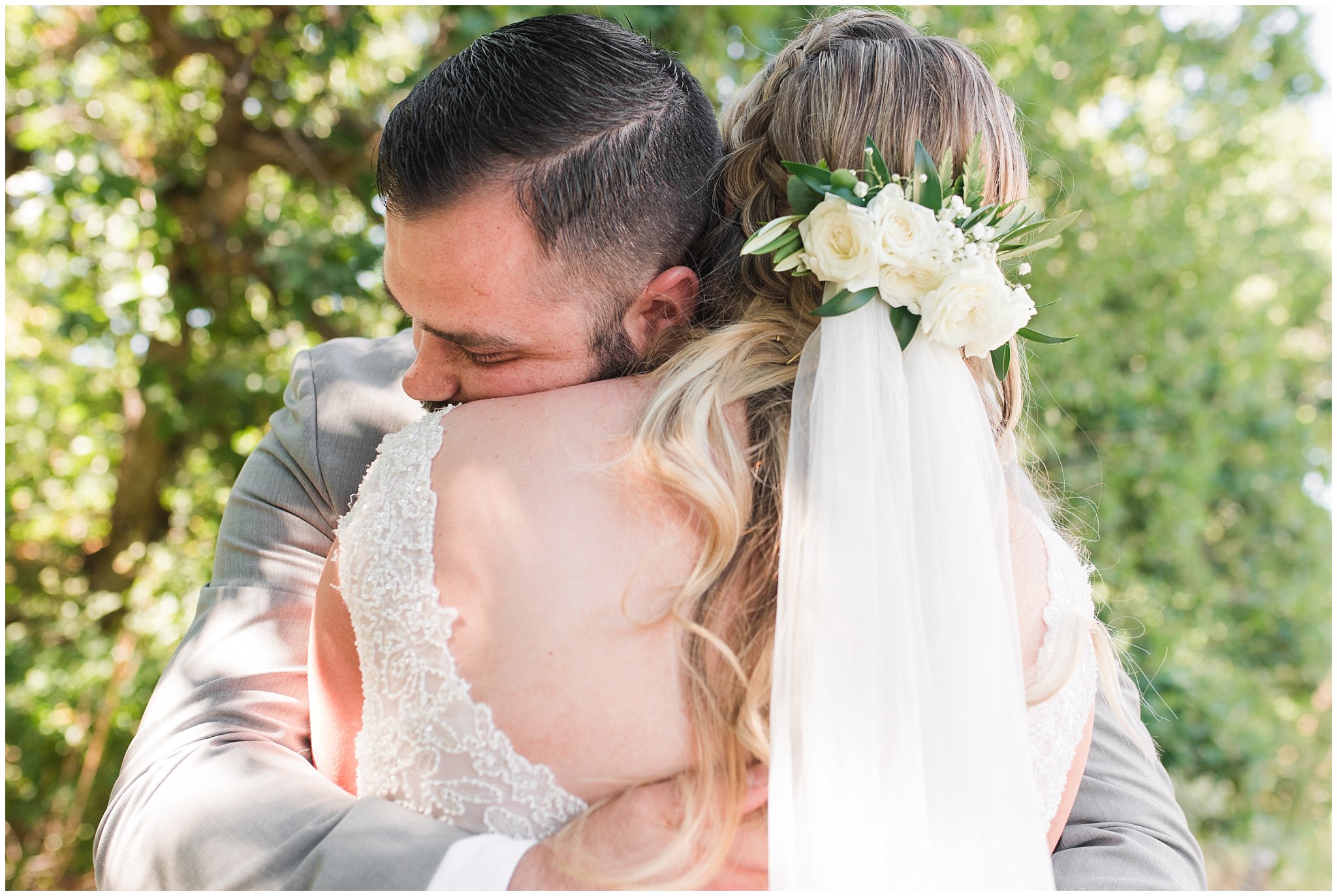 Bride and groom first look in woods wearing gray suit and sage green tie and champagne dress with veil | Sage Green and Gray Summer Wedding at Oak Hills | Jessie and Dallin Photography